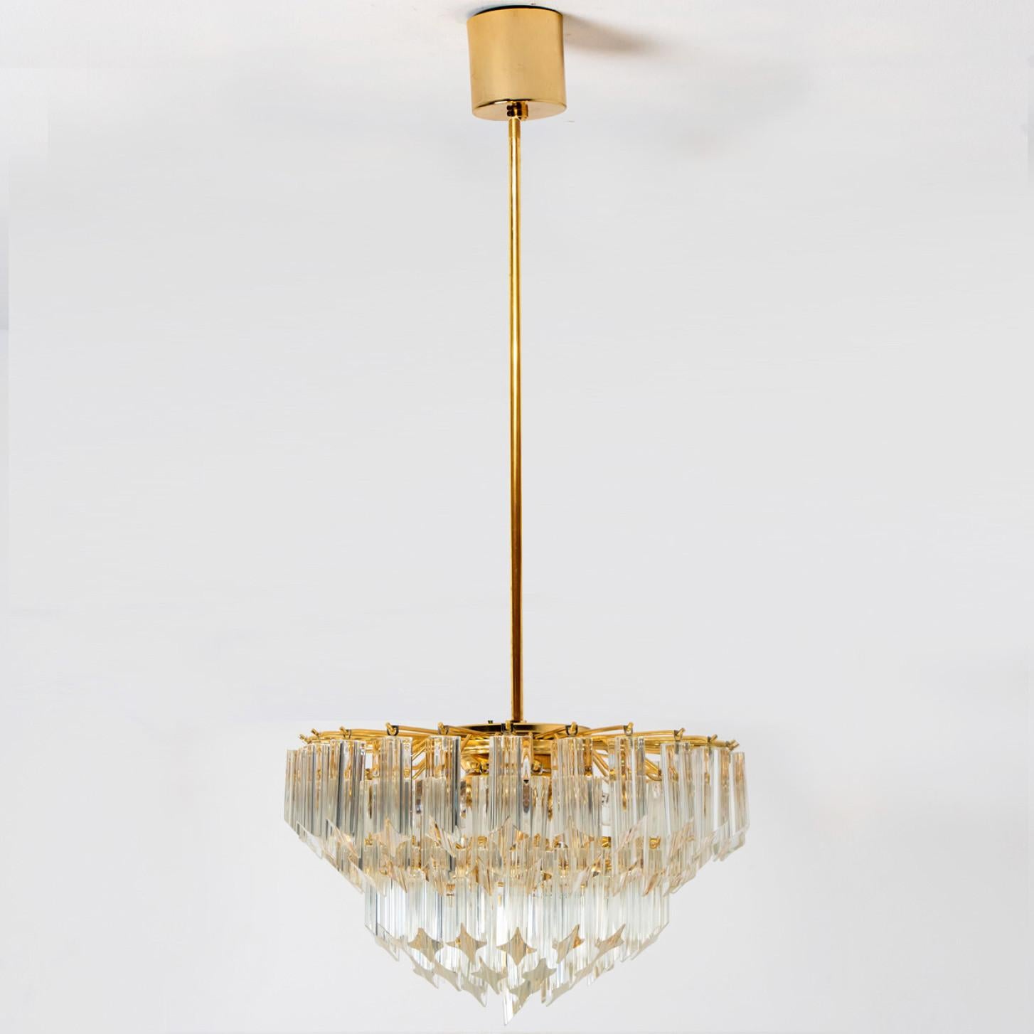 Beautiful chandelier featuring five tiers of multiple long crystal clear glass 
