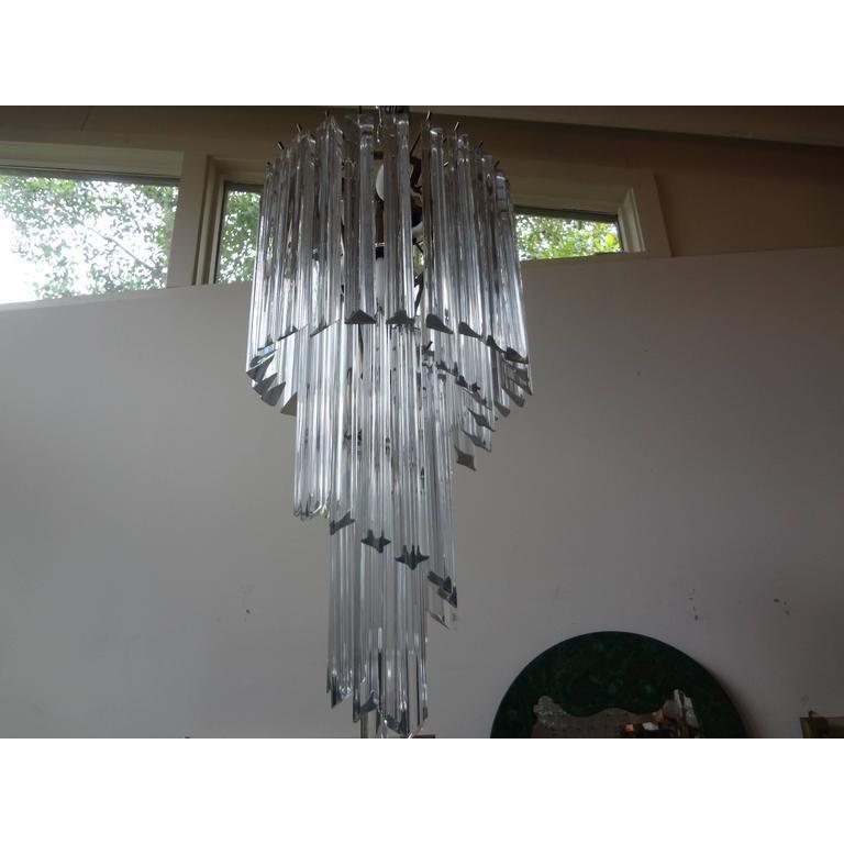 Murano glass Spiral chandelier, Venini style.
Italian midcentury Venini style Murano glass spiral chandelier or Murano lantern with clear prisms on a chrome structure. This Murano glass prism chandelier has been newly wired for U.S. market can be