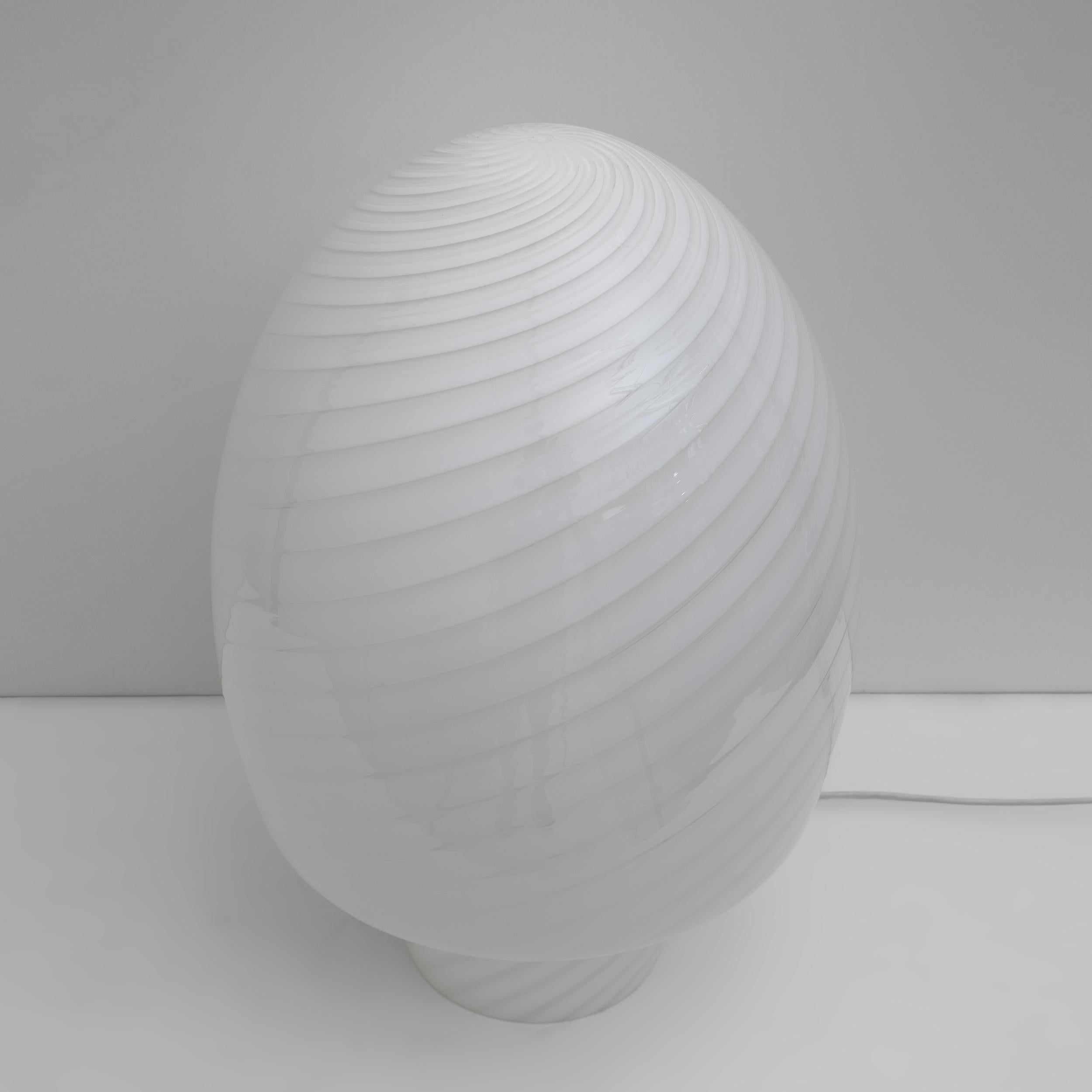 Murano Mushroom Lamp made with the vortex technique. The vortex features 2 colors of glass, gray and white, beautifully wrapped around the white glass base. Murano art glass is considered one of the most expertly crafted art glasses in the world and