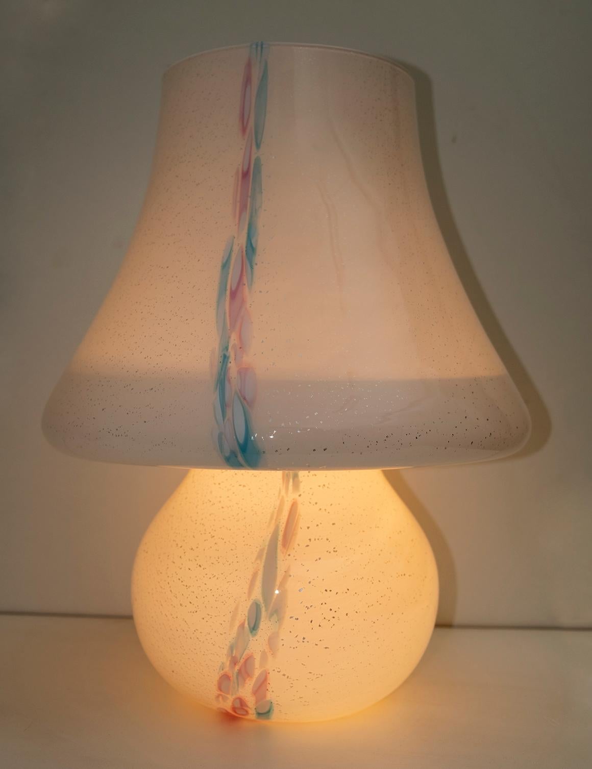 This Murano glass mushroom lamp was produced in the style of Venini in the 1980s, mouth blown glass with fragments of silver leaf and colored murrine.