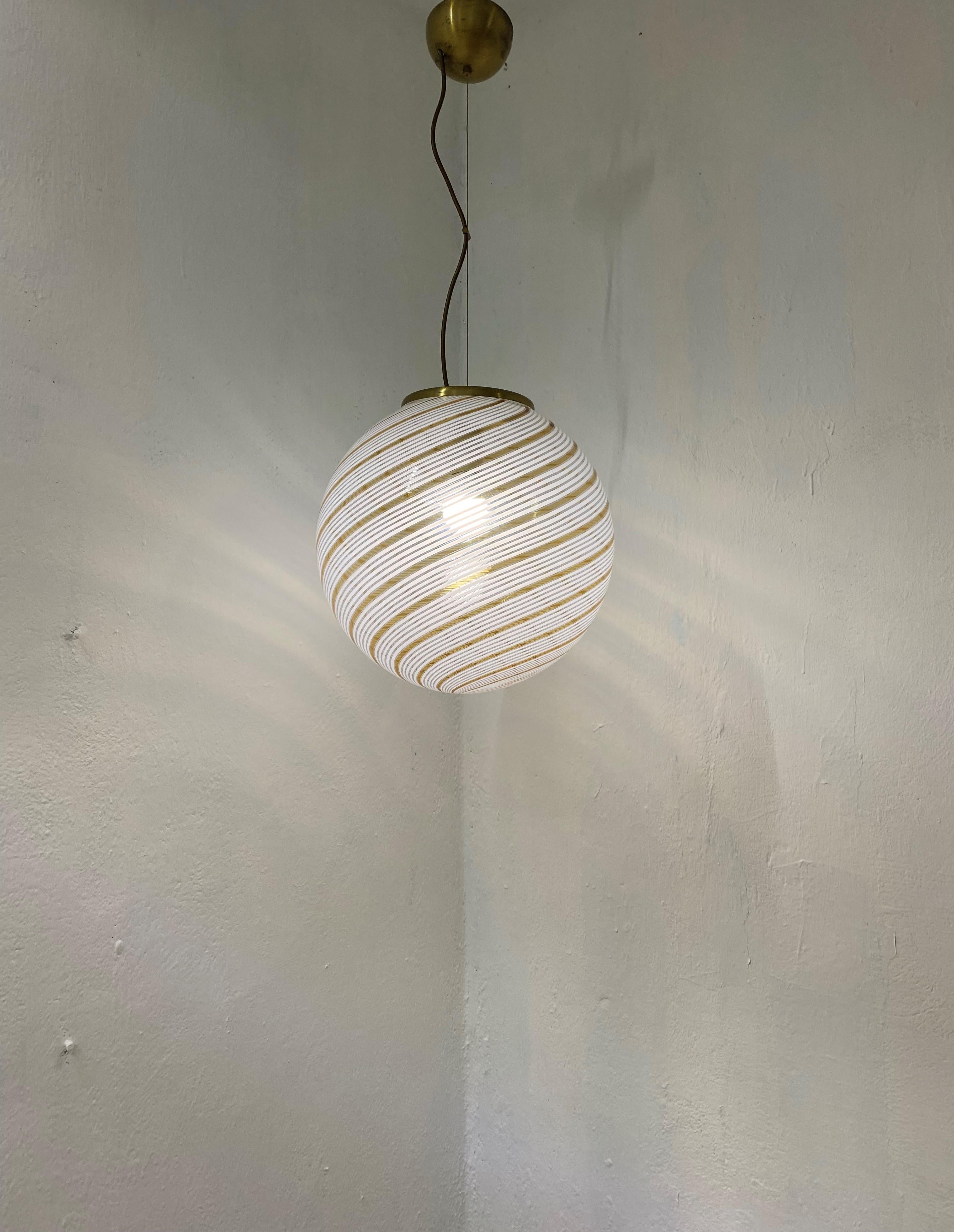 Beautiful and large pendant sphere in white and orange (yellow) and clear hand-blown Murano glass, attributed to Venini, circa 1970
The Bulb used will dramatically change the effect of the lamp when lit, please see the last 3 photos for the
