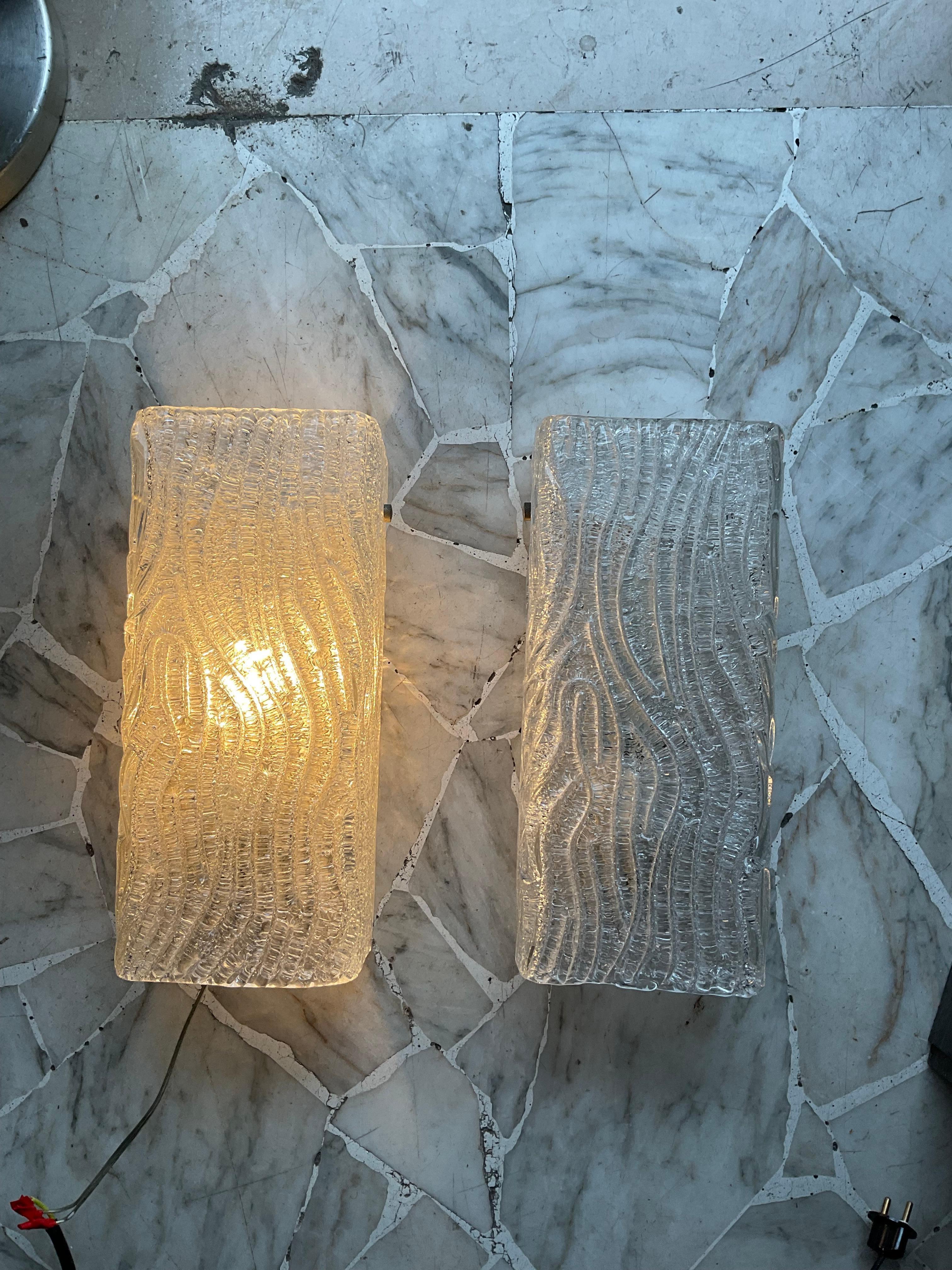 Pair of murano glass wall sconces ,produced by VENINI and designed by TONI ZUCCHERI, original from the 1960s and made in MURANO - ITALY.
They are in perfect condition and working , each carry a bulb attachment  large and being open top and bottom