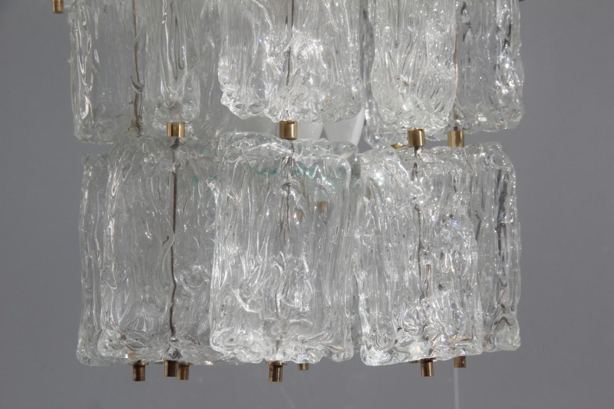 Venini Toni Zuccheri round chandelier glass Murano and brass part Italian design.

Bulbs 9 attack e14 max 40 watts each.