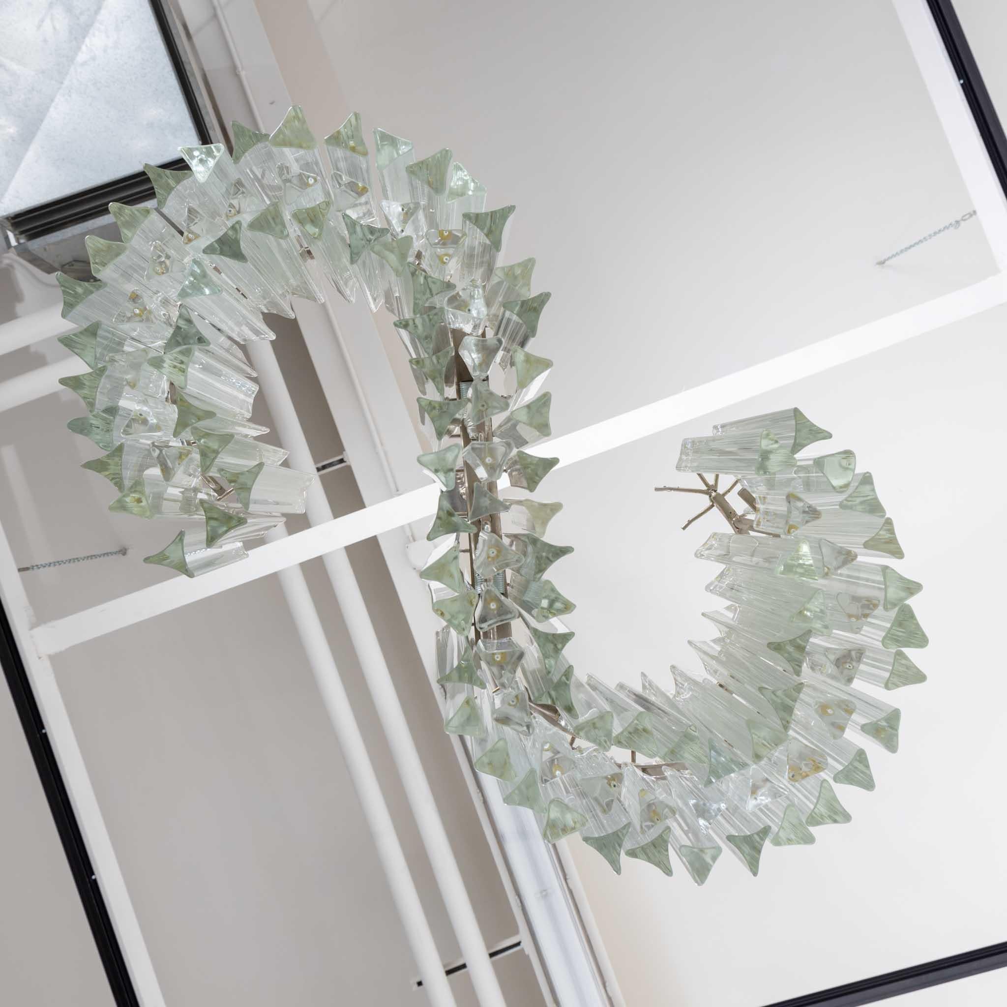 Venini chandelier with Triedri glass prisms of clear glass in beautiful S-shaped gradient.
