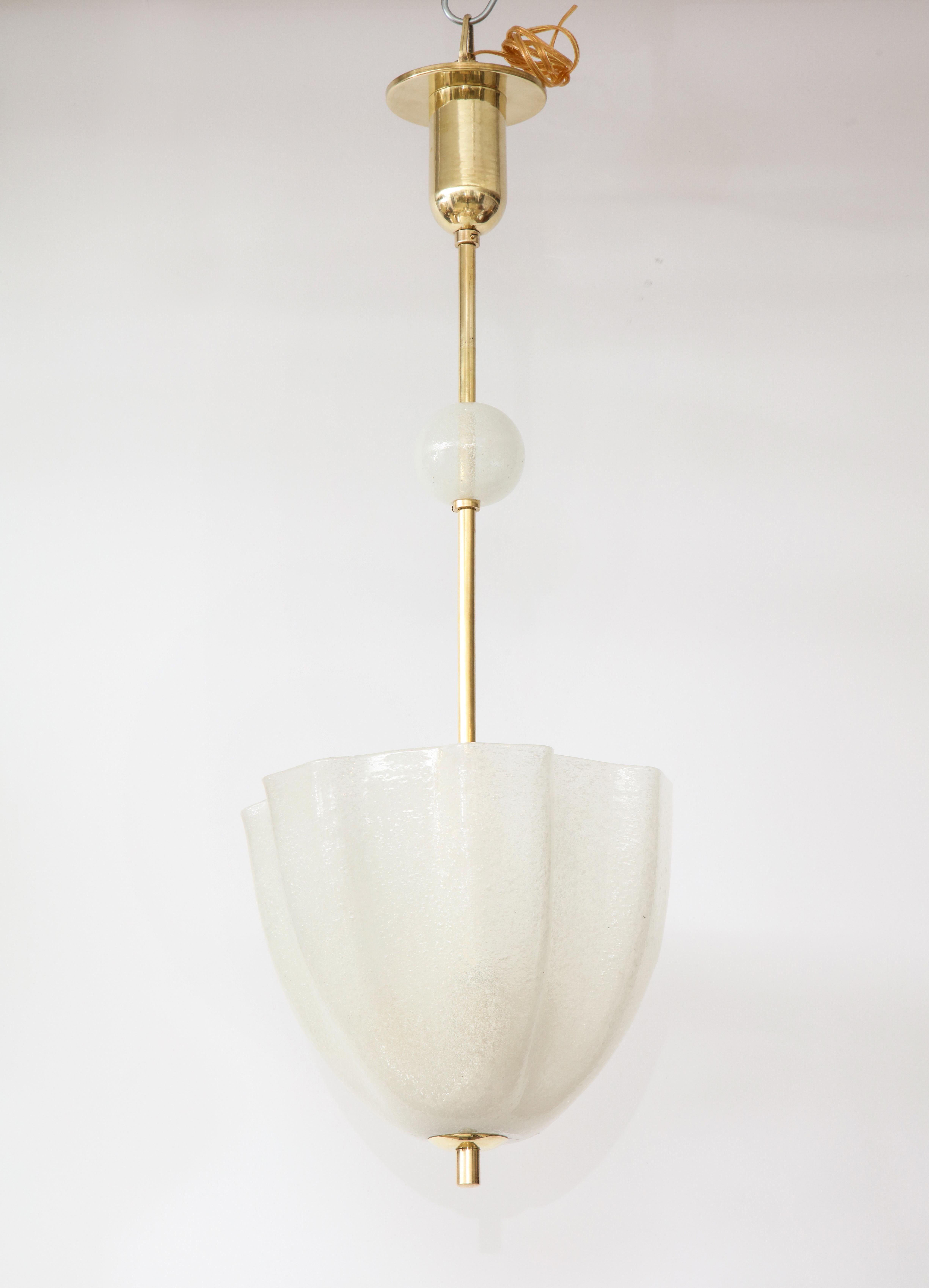 Venini tulip shaped frosted opaline glass pendant with brass columnar support and canopy with circular adjustable opaline glass globe on brass stem. (Re-wired for USA standards).
Venice, Italy, 1940s
Size: 32