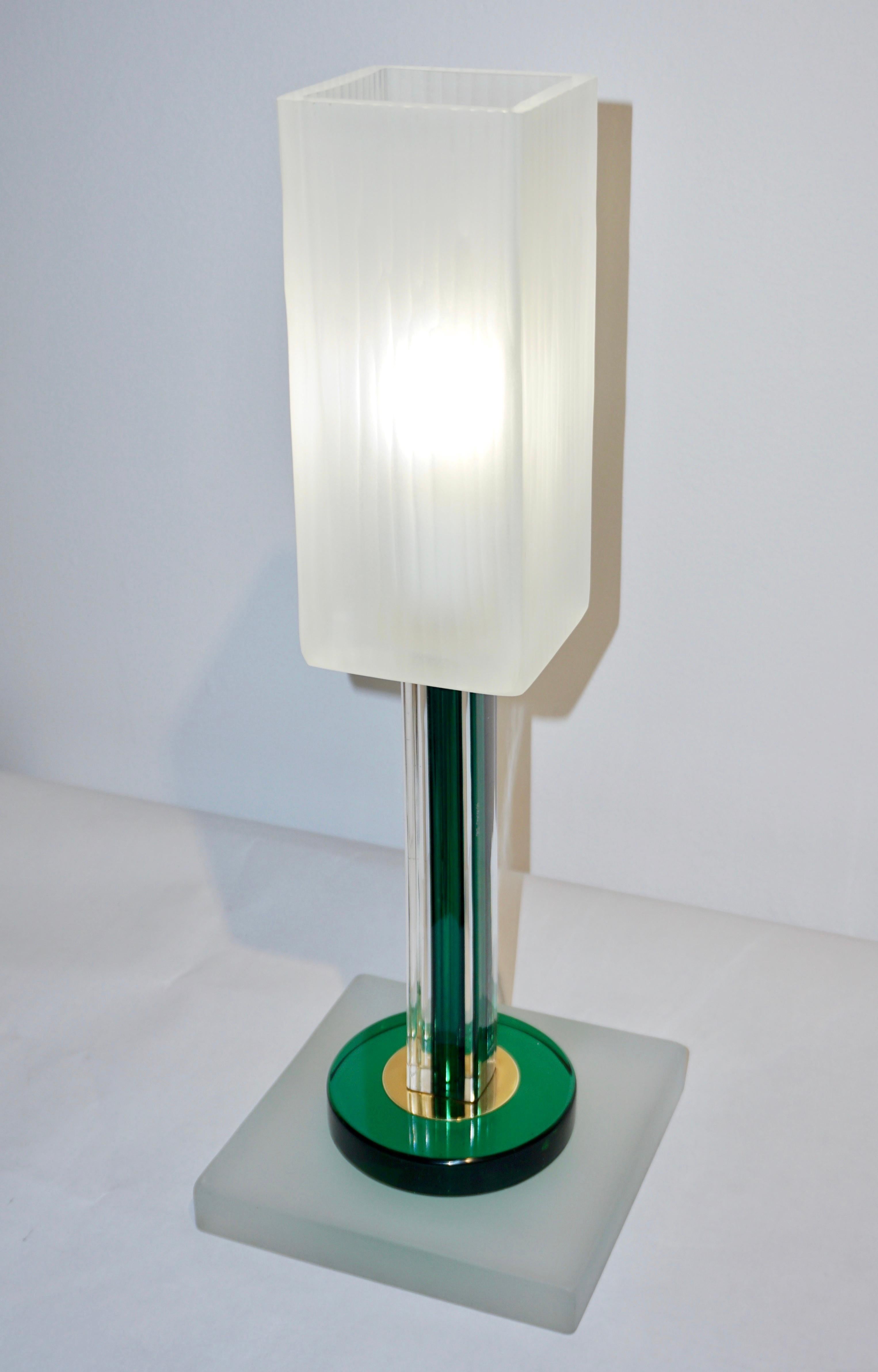 Do you want elegance and emerald green highlights in your room accents? Not just a pair of lamps, this is sculptural and ornamental lighting. A rare Italian Minimalist pair of lamps signed Venini 1992 of modern geometric design. Venini pieces always