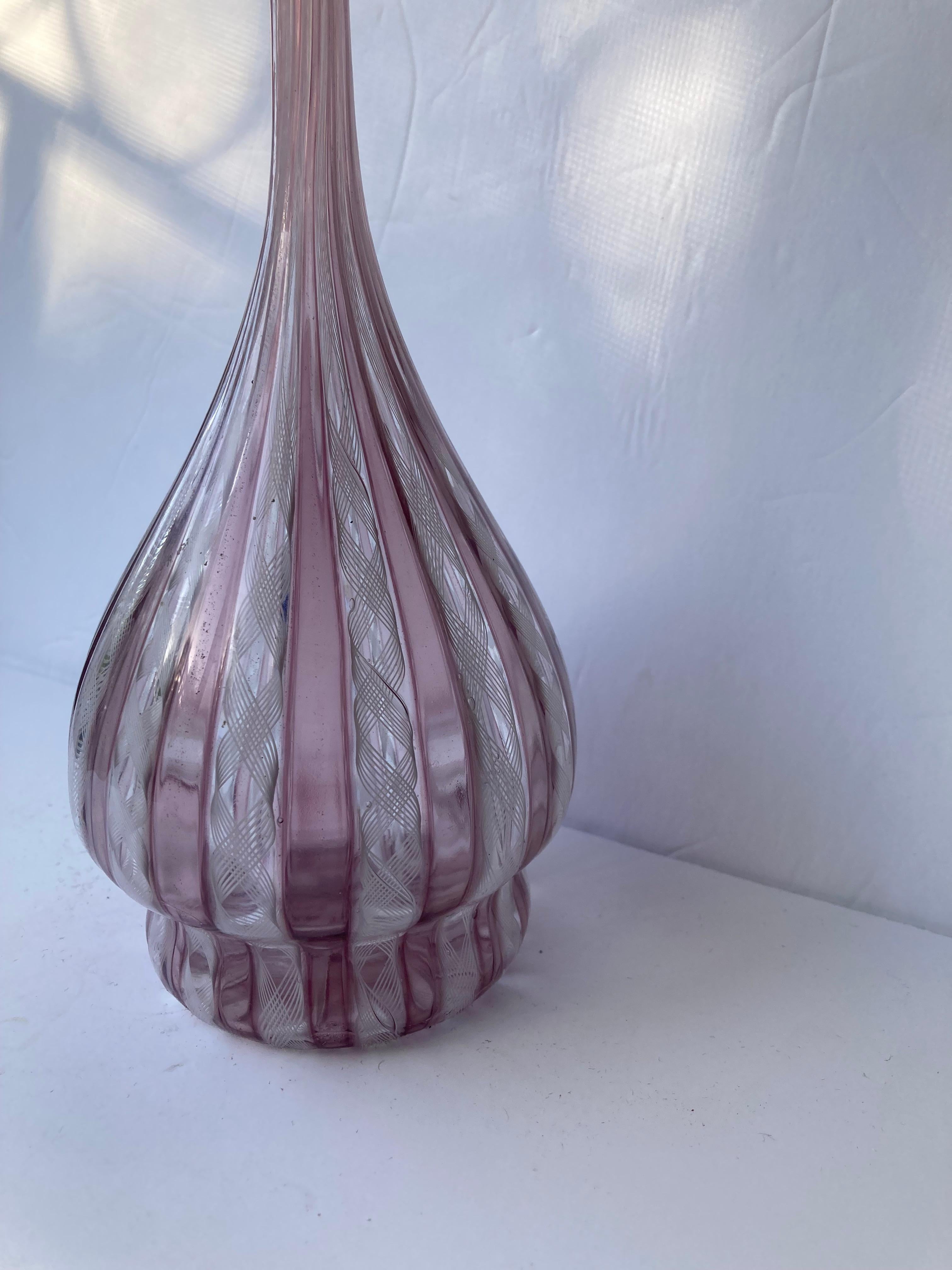 Beautiful Venini vase in this canes twisted work, zanfirico technic that makes lattice patterns . This vase has a neck shape and is signed in bottom diamond point 