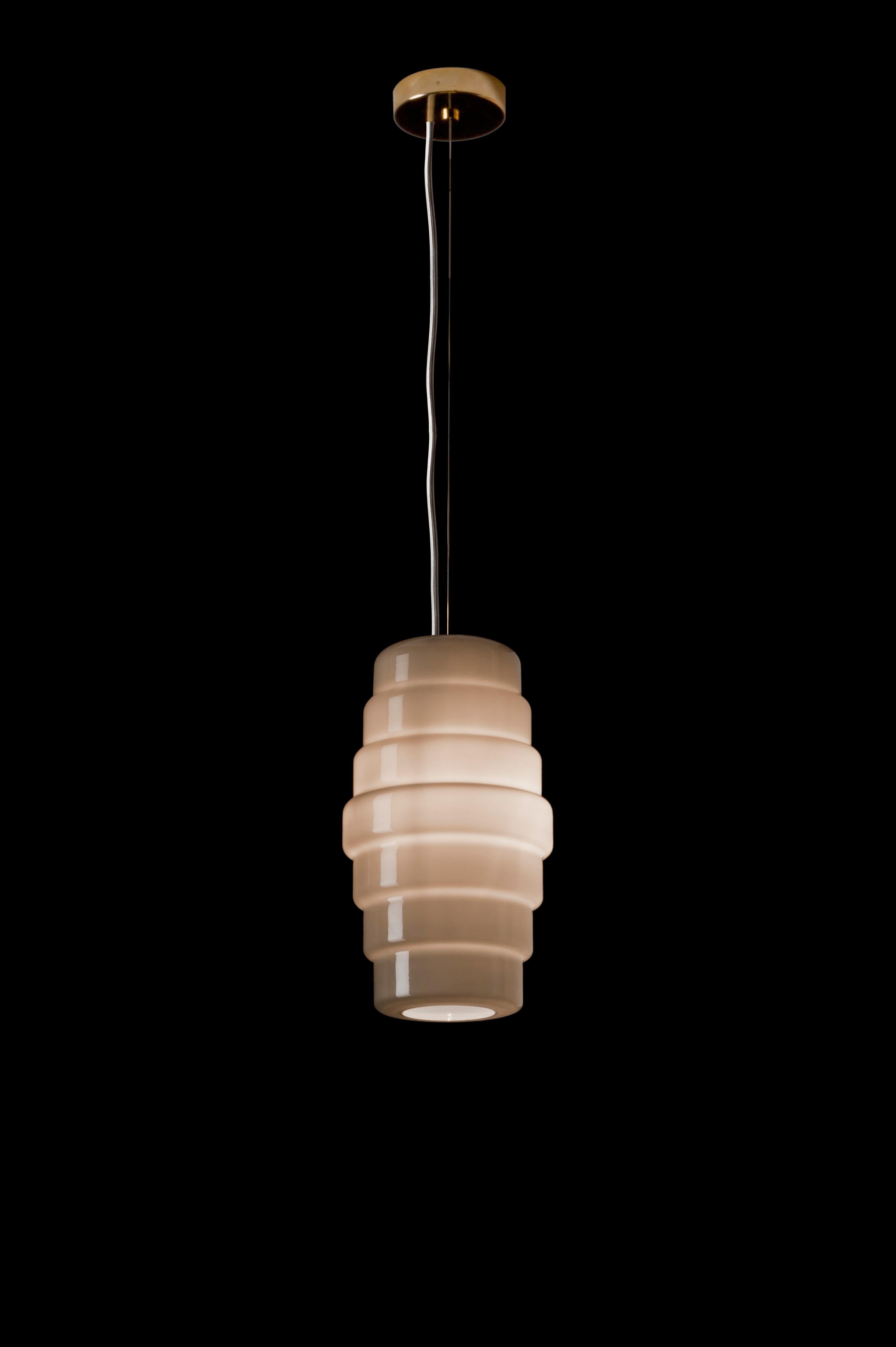 Zoe pendant lamp, designed by Doriana and Massimiliano Fuksas and manufactured by Venini, features a lantern shape. Available in two different sizes. Indoor use only.

Dimensions: Ø 30 cm, H 52.5 cm.