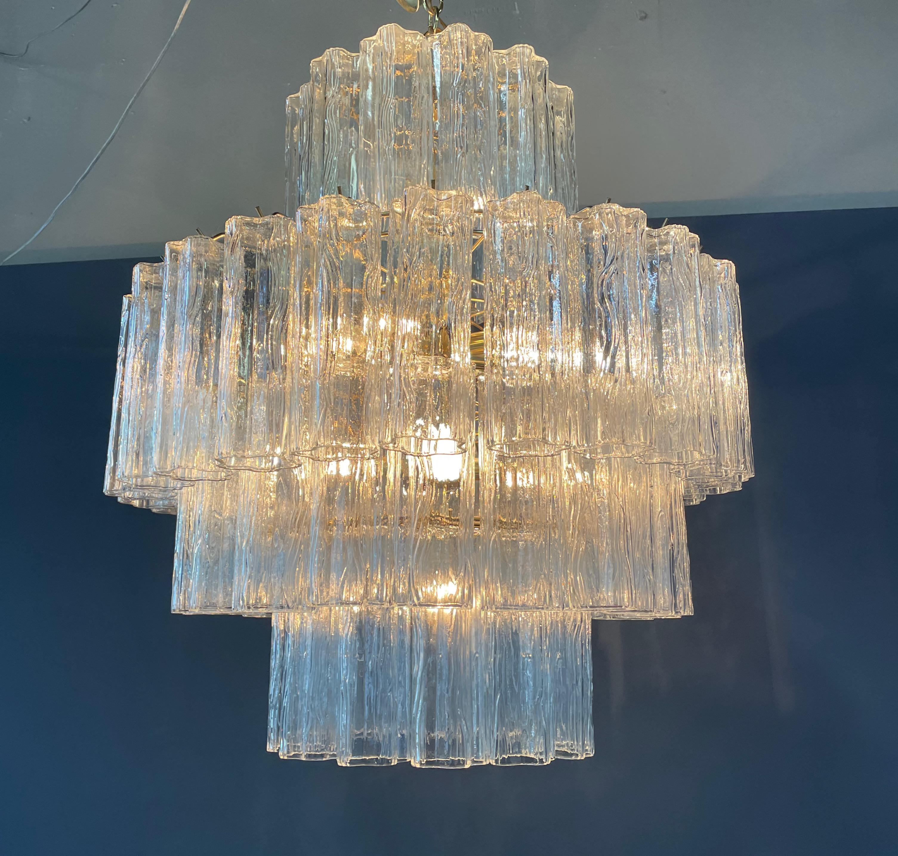 This impressive midcentury 1960s Venini Murano 3-tier chandelier with brass frame will frame any room.