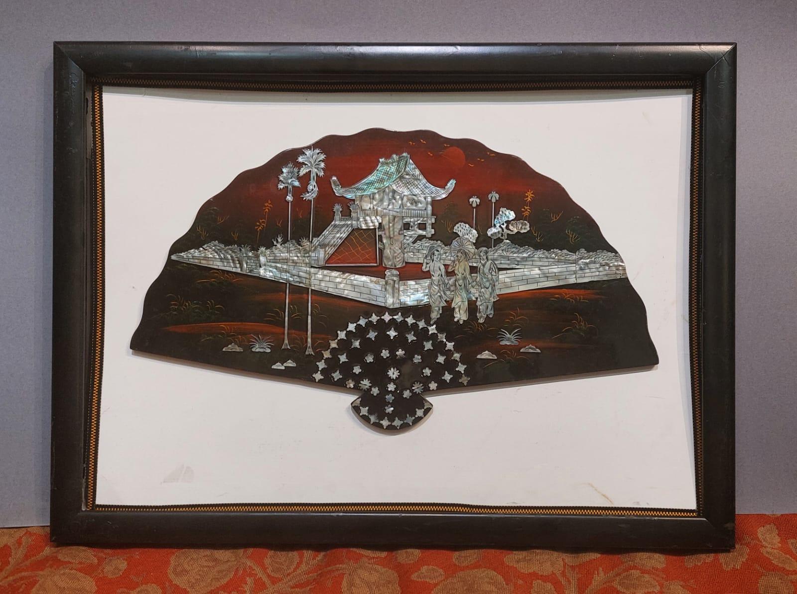 The fan is made of painted and then lacquered wood, inlaid with mother-of-pearl elements.

The scene depicted features three maidens in the foreground, dressed in traditional Japanese clothing, probably as they are returning home. Behind them is a