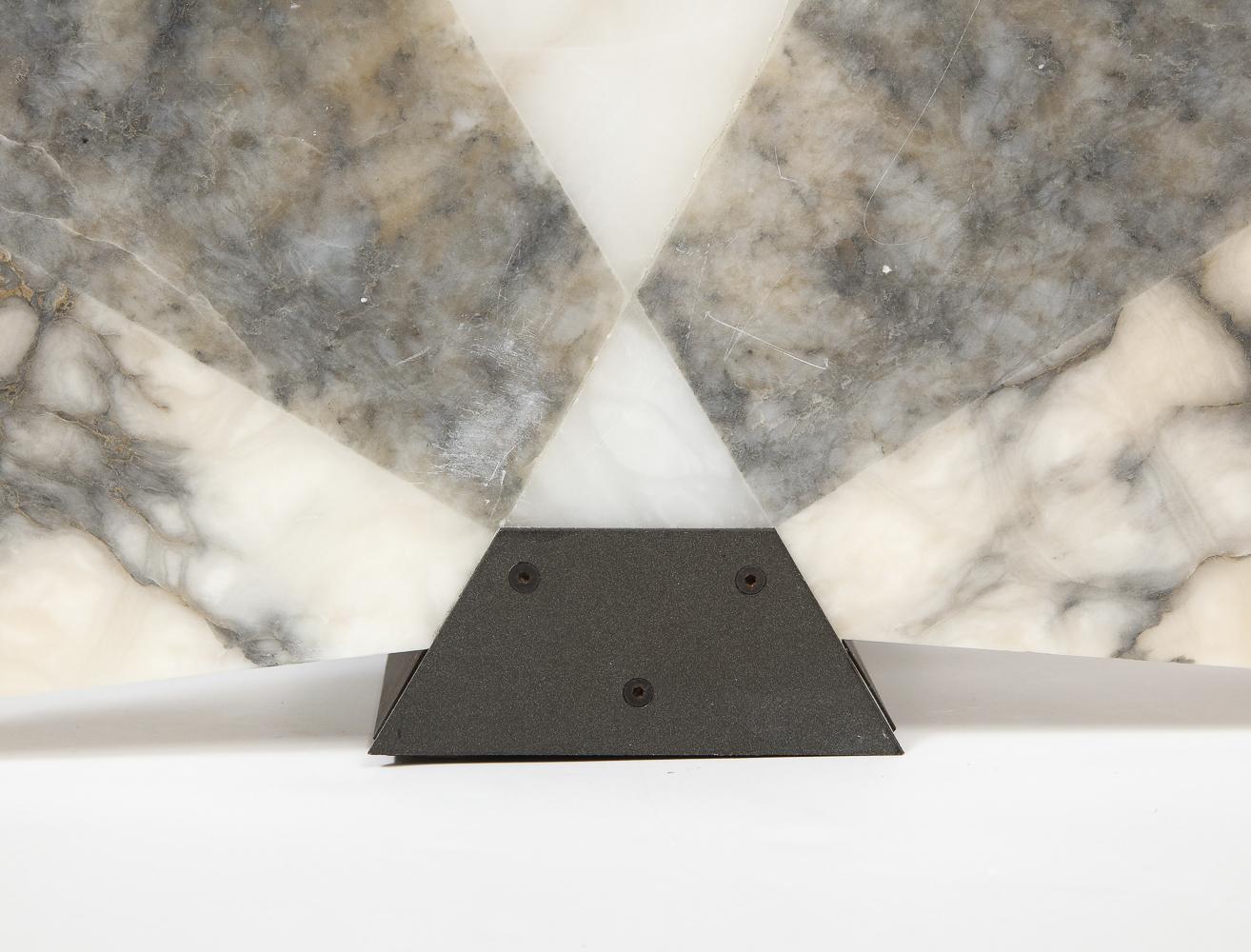 Marble, painted metal. Produced by Skipper Pollux. 3 different marble types fused together to form a semi-circular light diffuser.