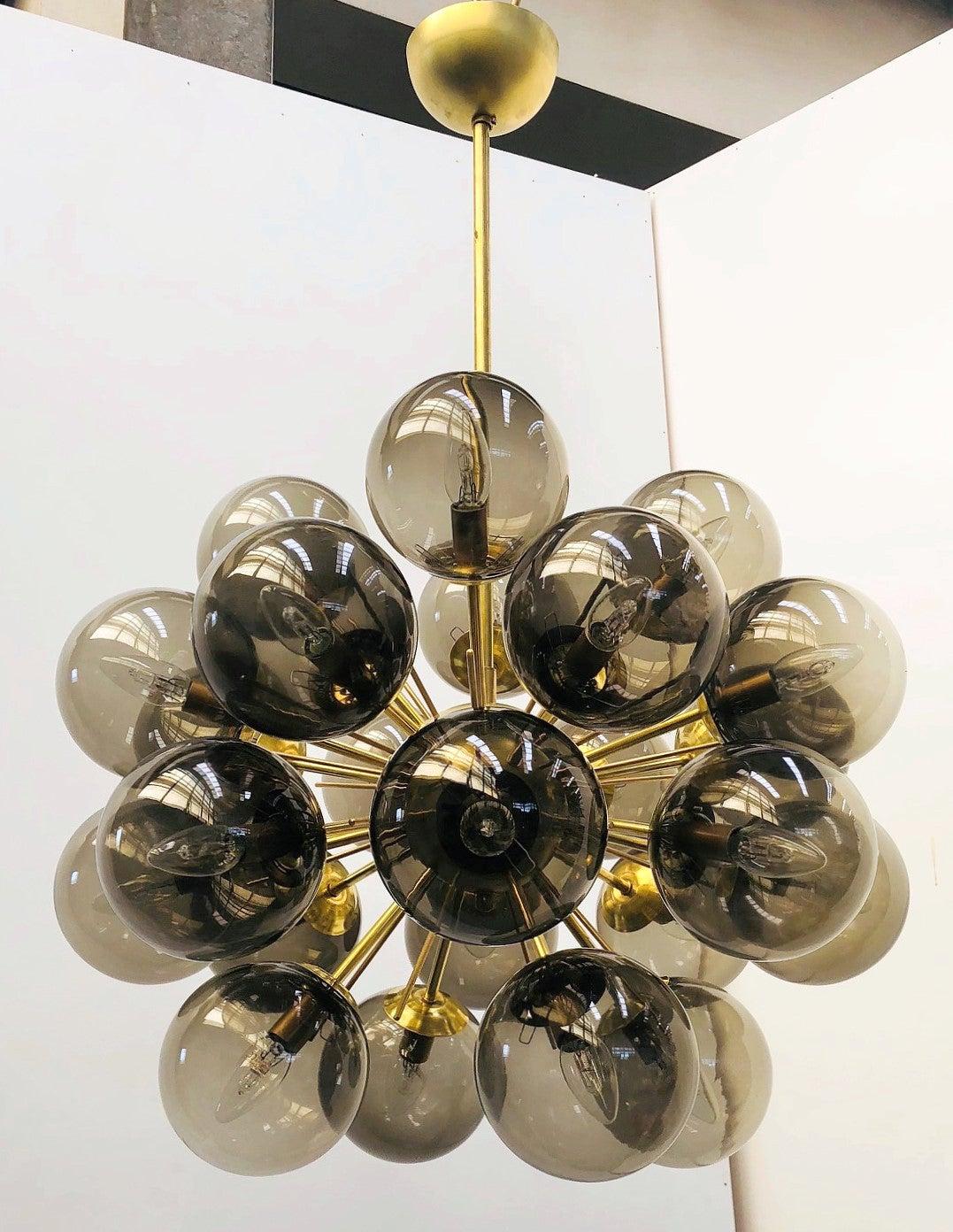 Italian sputnik chandelier with 24 Murano glass globes mounted on brass frame / Designed by Fabio Bergomi for Fabio Ltd / Made in Italy
24 lights / E12 or E14 type / max 40W each
Diameter: 28 inches / Height: 39 inches including rod and canopy
Order