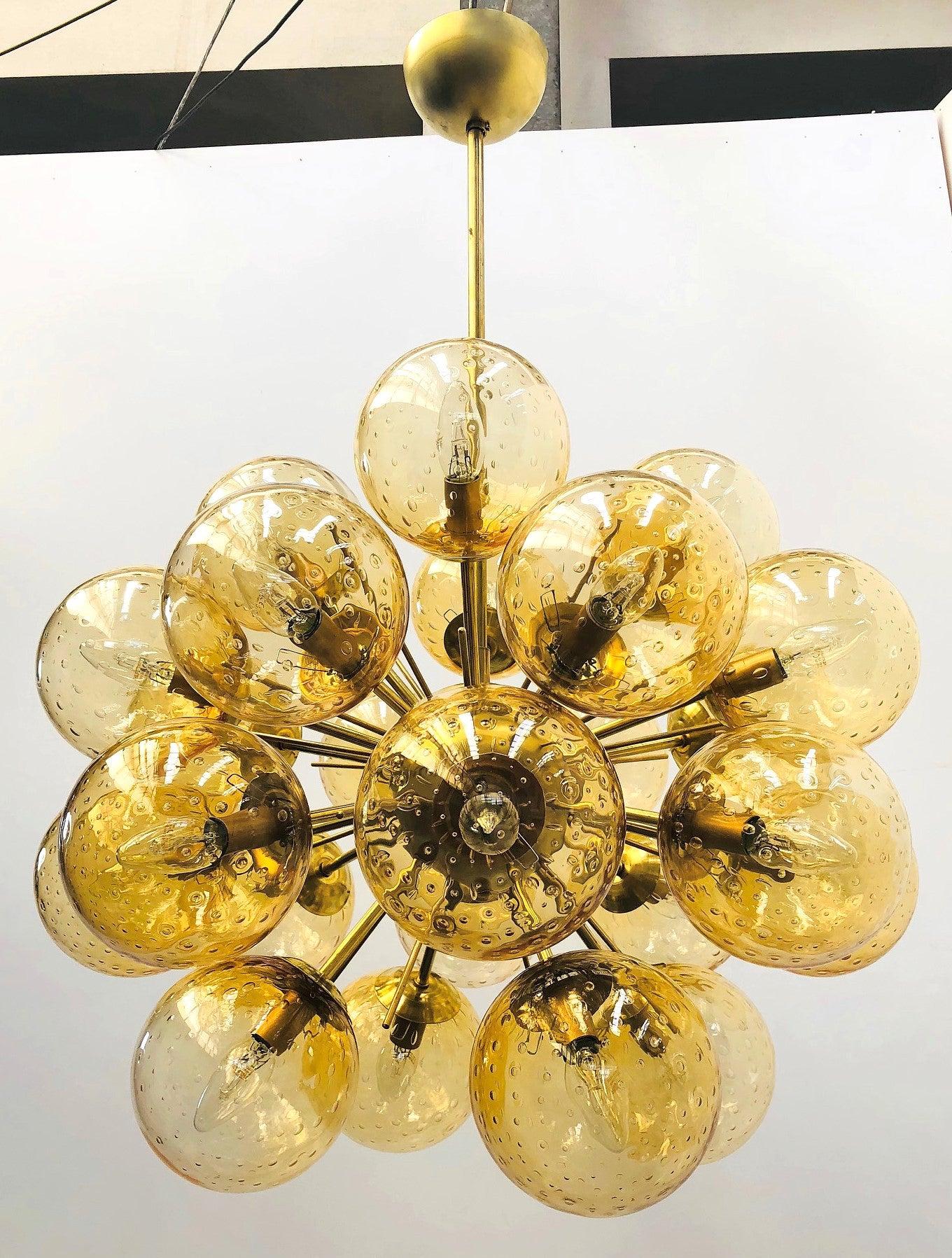 Italian sputnik chandelier with 24 Murano glass globes mounted on brass frame / Designed by Fabio Bergomi for Fabio Ltd / Made in Italy
24 lights / E12 or E14 type / max 40W each
Diameter: 28 inches / Height: 39 inches including rod and canopy
Order