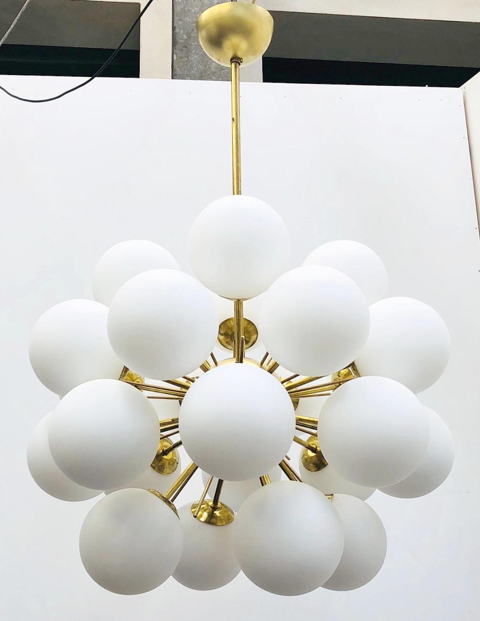 Italian sputnik chandelier with 24 Murano glass globes mounted on brass frame / Designed by Fabio Bergomi for Fabio Ltd / Made in Italy
24 lights / E12 or E14 type / max 40W each
Diameter: 28 inches / Height: 47 inches including rod and canopy
Order