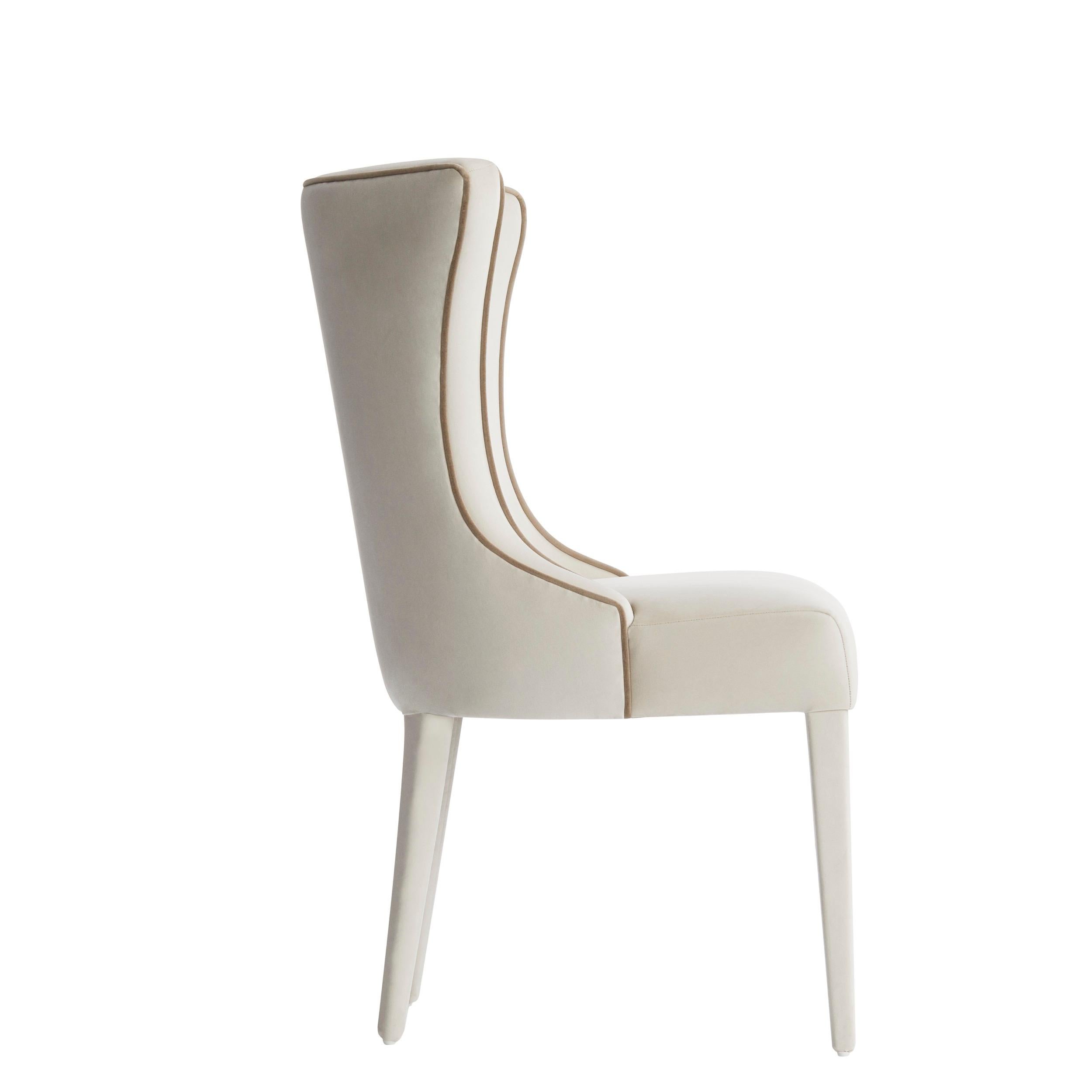 VENTURA  is a classic chair by Casa Magna, characterized by the enveloping backrest and the elegant contrasting piping that runs along the entire backrest.‎ Ventura is the perfect chair for any dining room.‎ Legs and structure can also be