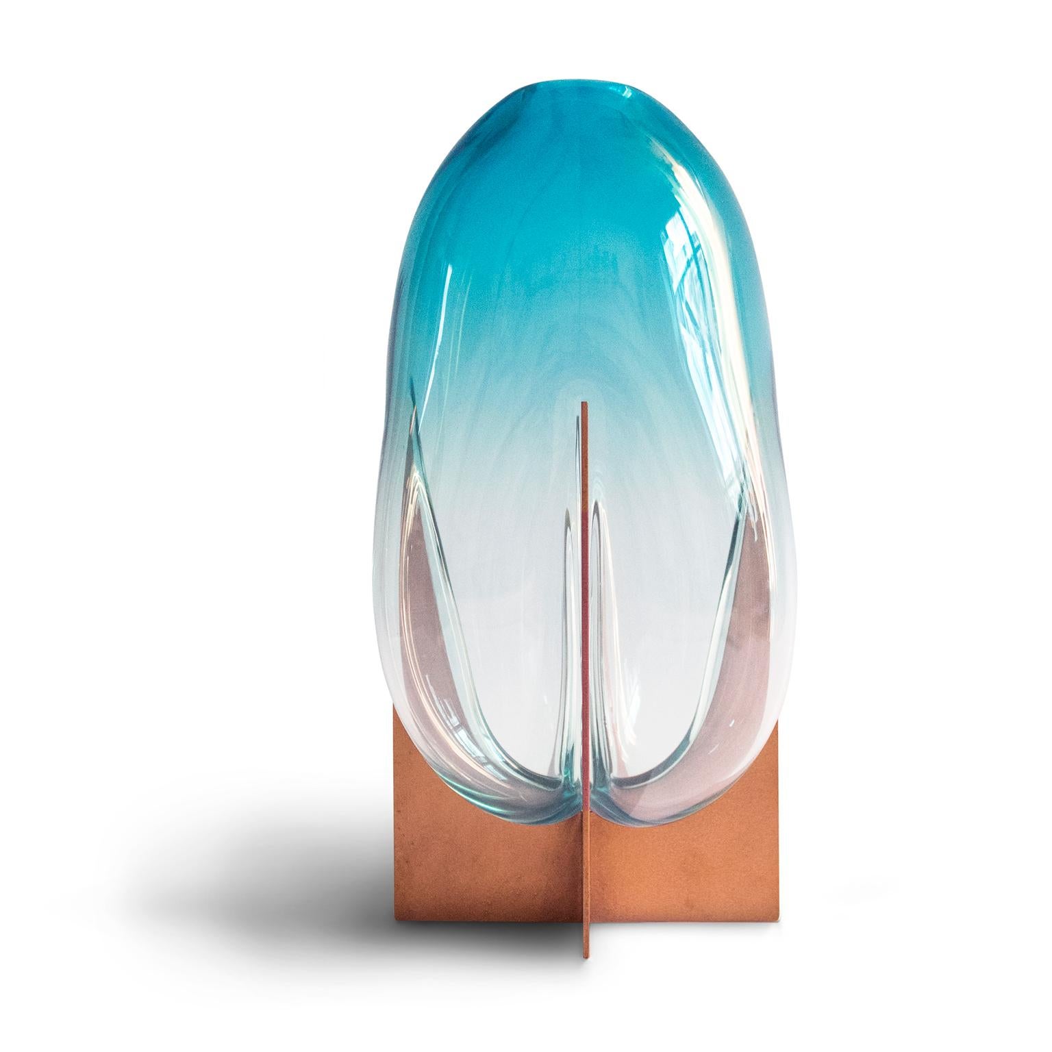 Lara Bohinc’s collection is inspired by her encounters with Venice. Metal frames hold Bohinc’s Murano glass vases and are reminiscent of the foundations upon which Venice was built: the metal is strong, rigid and geometric; the glass likes water,