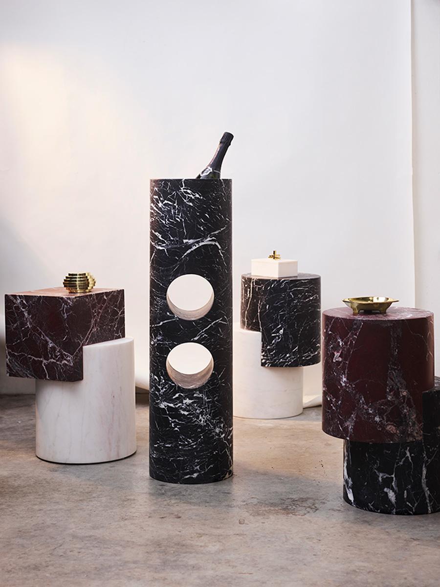 Juxtaposed shapes in solid marble make the Venturi side table a striking architectural piece. This mini monolith explores the intersection of line, pattern and colour using the matchless beauty of natural stone. 

Formed from two solid blocks of