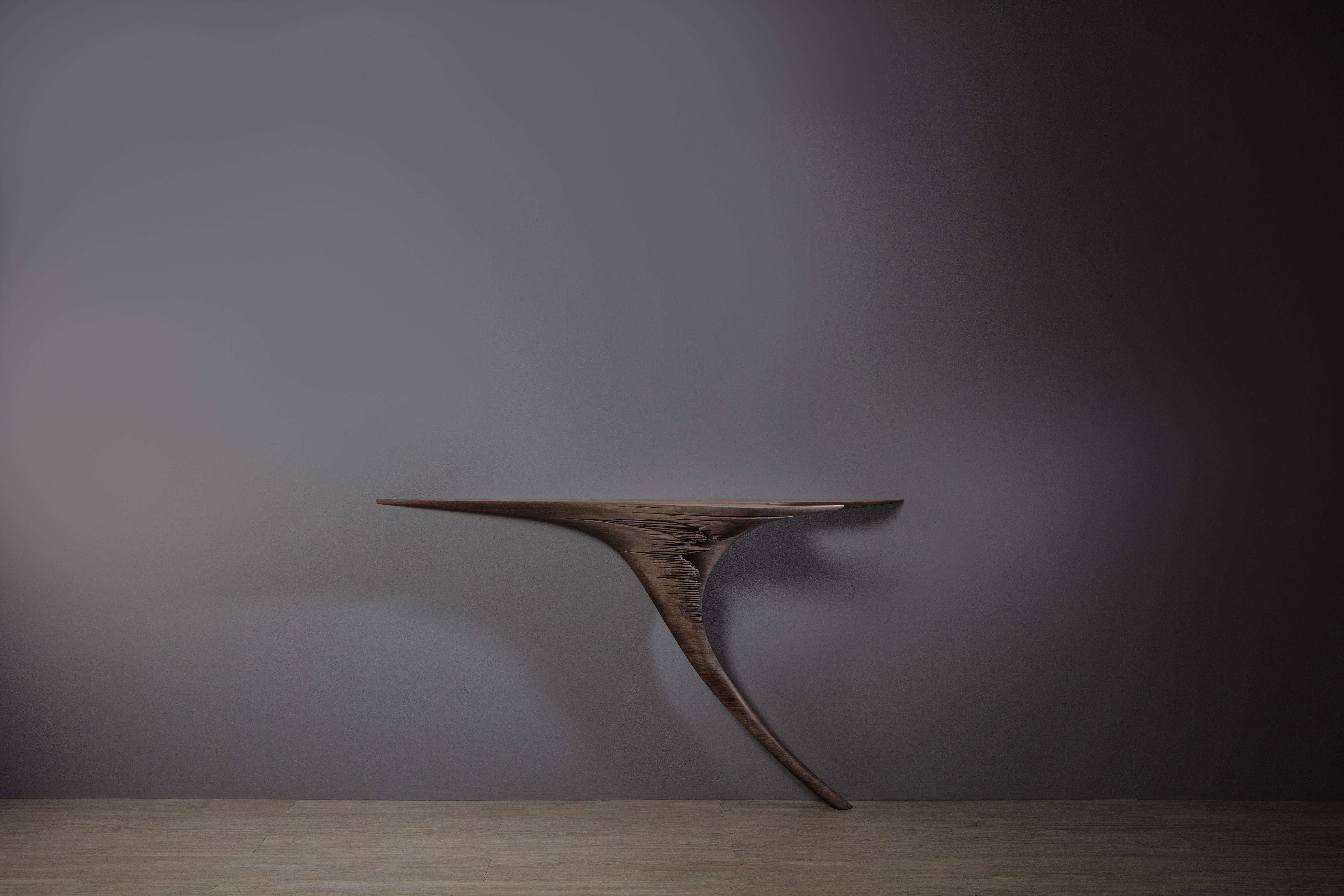 Ventus Hand-Sculpted Console Table in Eroded American Walnut by Tor Rothschild
Unique Piece
Dimensions: D 30 x W 150 x H 87 cm.
Materials: Eroded American Walnut.

All pieces are hand-sculpted individually; therefore, natural variations in form,