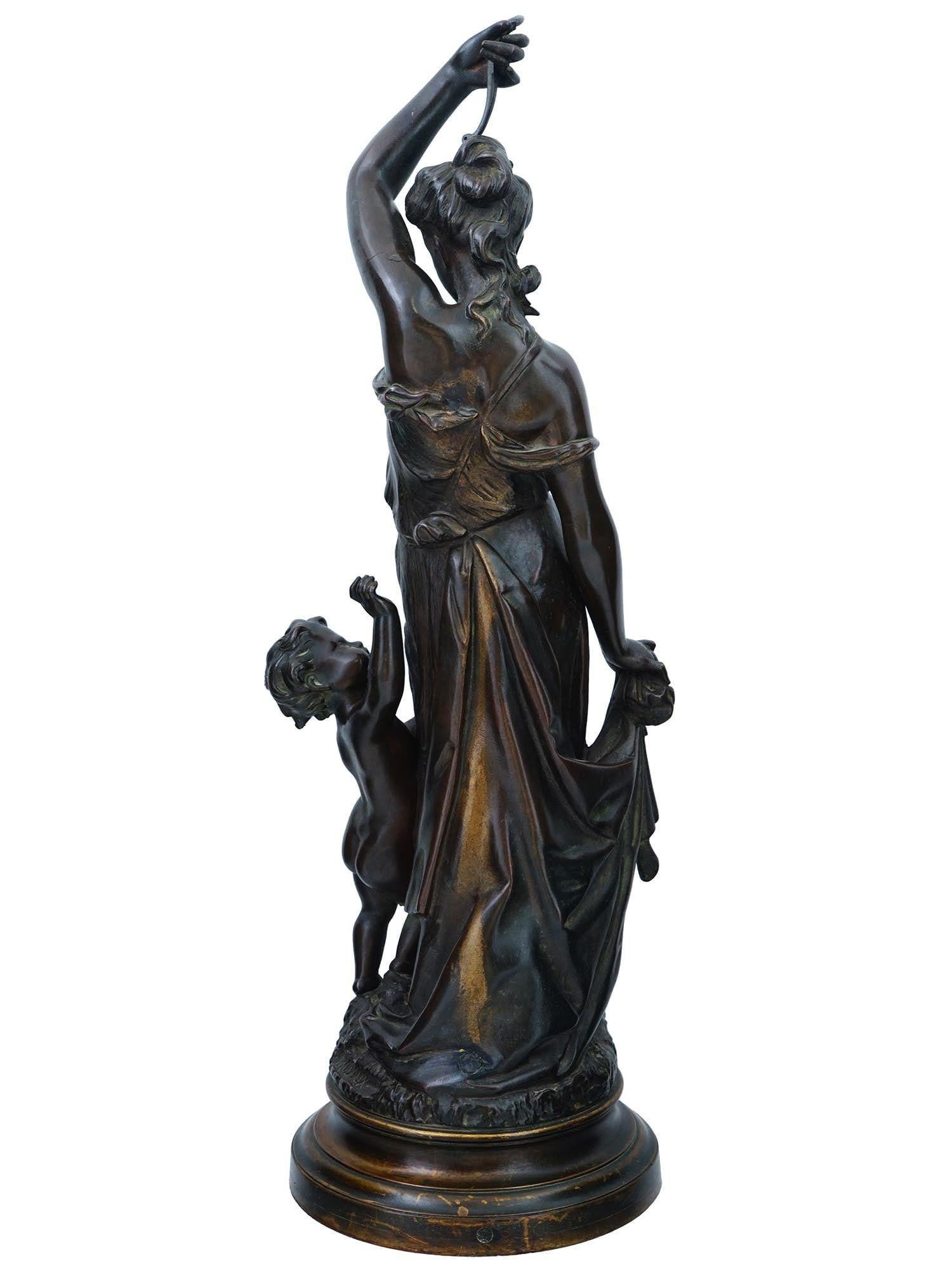 Antique (19th century) patinated bronze sculpture, Amour Desarme (Love Disarmed) after the original model by Henri Emile Adrien Trodoux (1815-1881), depicting the Roman goddess, Venus, teasing Cupid at her feet, holding his bow above her head.