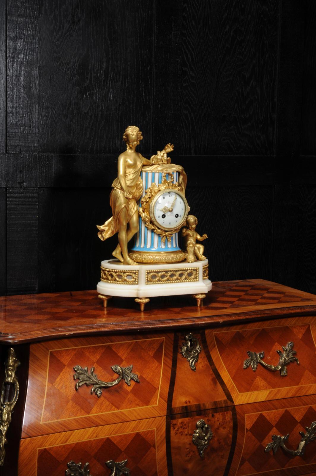 A stunning ormolu and Sèvres style porcelain clock, after the original clock in Marie-Antoinette's apartment in the Palace of Versailles. It dates from circa 1870. Venus is beautifully depicted leaning on a classical column with two doves, two