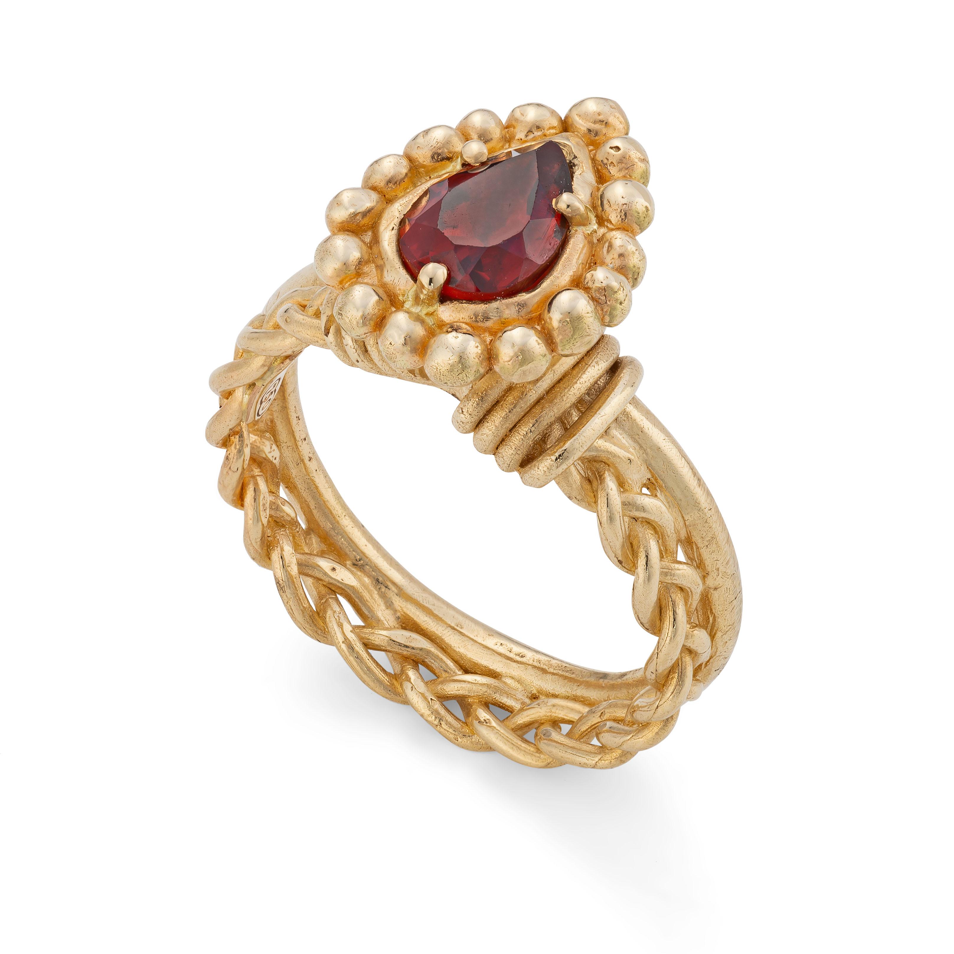 Venus Ring, 18 Karat Yellow Gold with Garnet
Handcrafted and individually cast in 18-karat solid yellow gold. Olivia carves each piece from wax, making these items unique, which we believe is what gives them their beauty. 
In Roman mythology, Venus