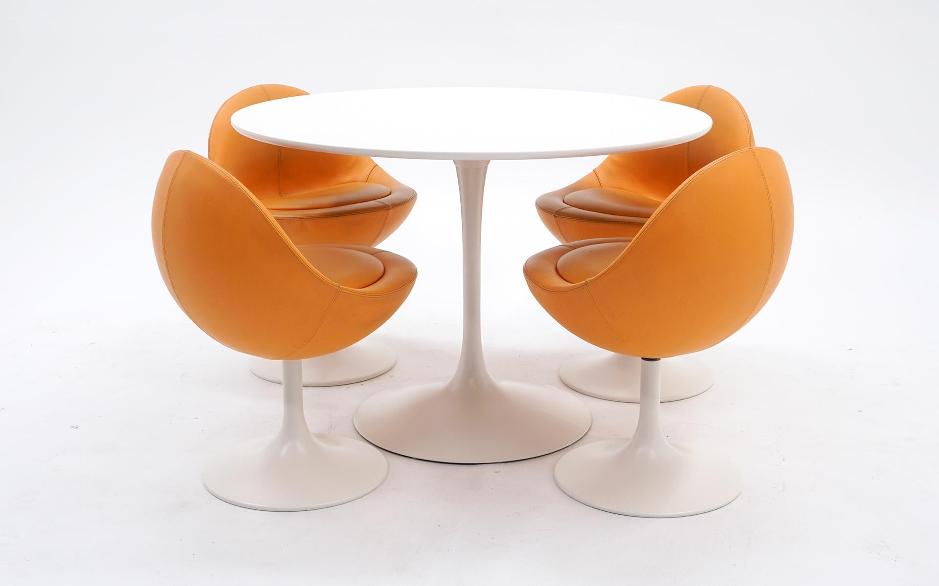 Mod dining table and four swivel pod chairs designed by Borge Johansen and similar to designs by Eero Saarinen for Knoll. The table and chair bases and been restored with a conversion varnish finish which is super smooth and very durable. The table