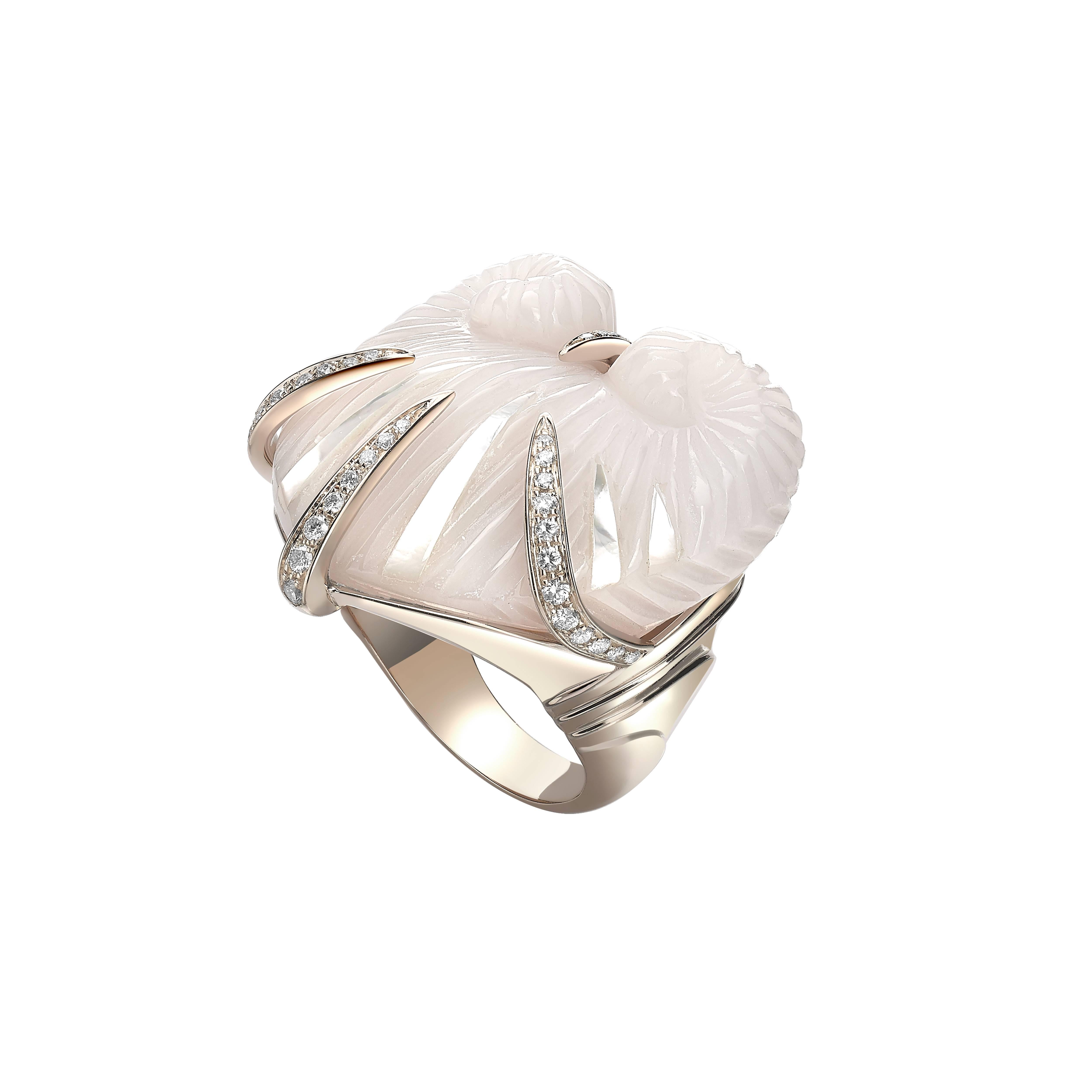 Ring size 49, 51 & 53 available.
(Alternative sizes available on a made to order basis, with an estimated delivery time of 4-6 weeks)

18k White Gold approx. 12.10gr, 40 Diamonds 0.38ct and 1 Pink Chalcedony with Mother Of Pearl 52.50ct

Shells – an