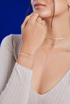 Vera Belleza's Floating Round brilliant cut diamonds in 18k gold chain Bracelet