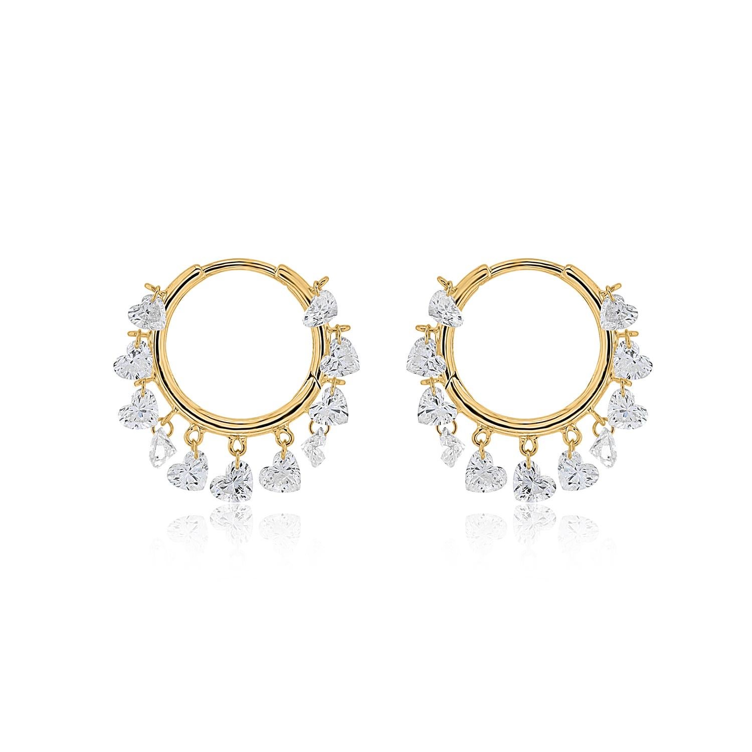 Celebrate love and elegance with Vera Belleza's heart-shaped Brilliant cut diamond hoops, crafted in radiant 18k gold. These exquisite earrings feature pierced diamonds, delicately suspended to create a soft, graceful movement that catches the light