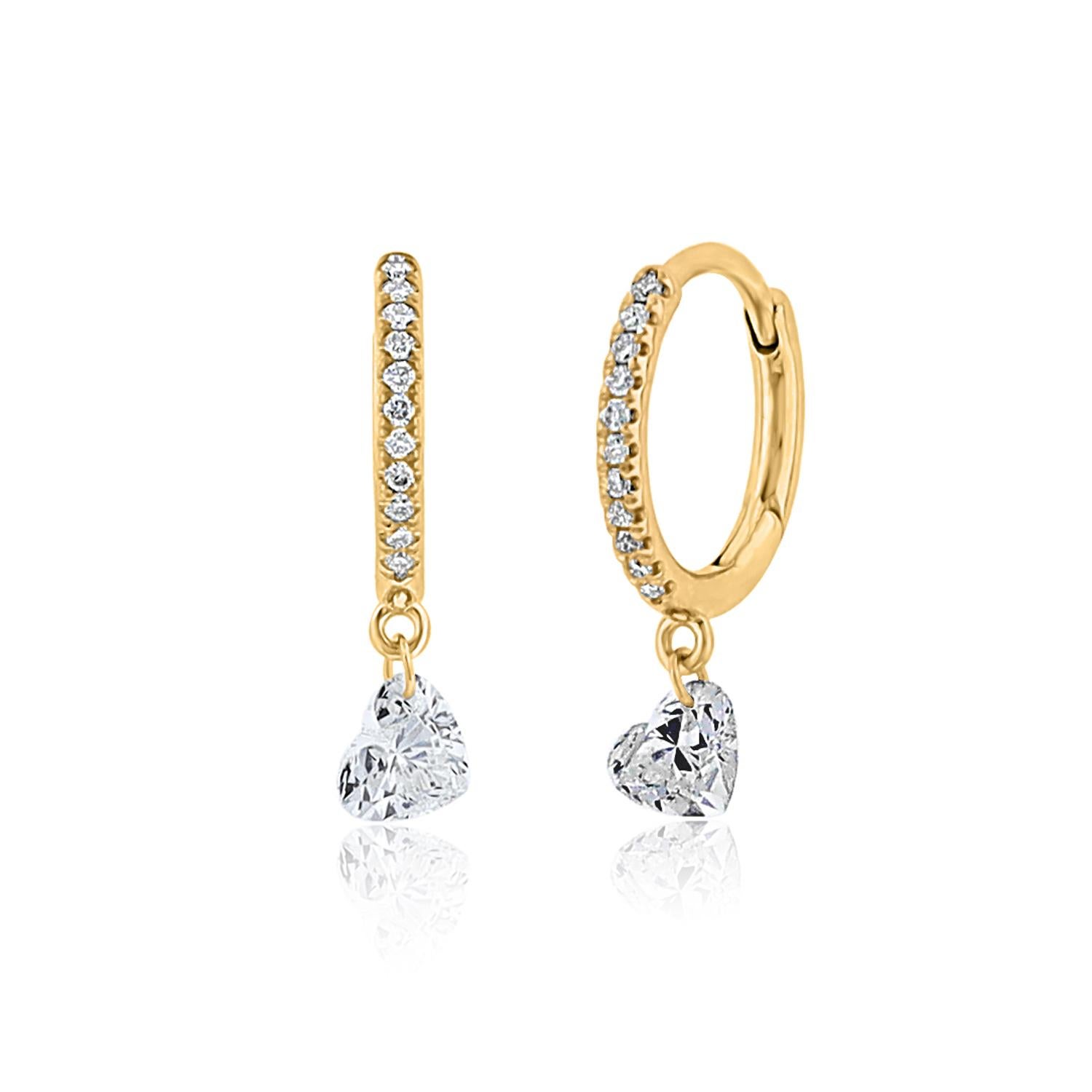 Elevate your everyday style with Vera Belleza's single heart-shaped brilliant-cut diamond hoops, crafted in lustrous 18k gold. Featuring a delicately pierced heart-shaped diamond, this design exudes simplicity and elegance, making it the perfect
