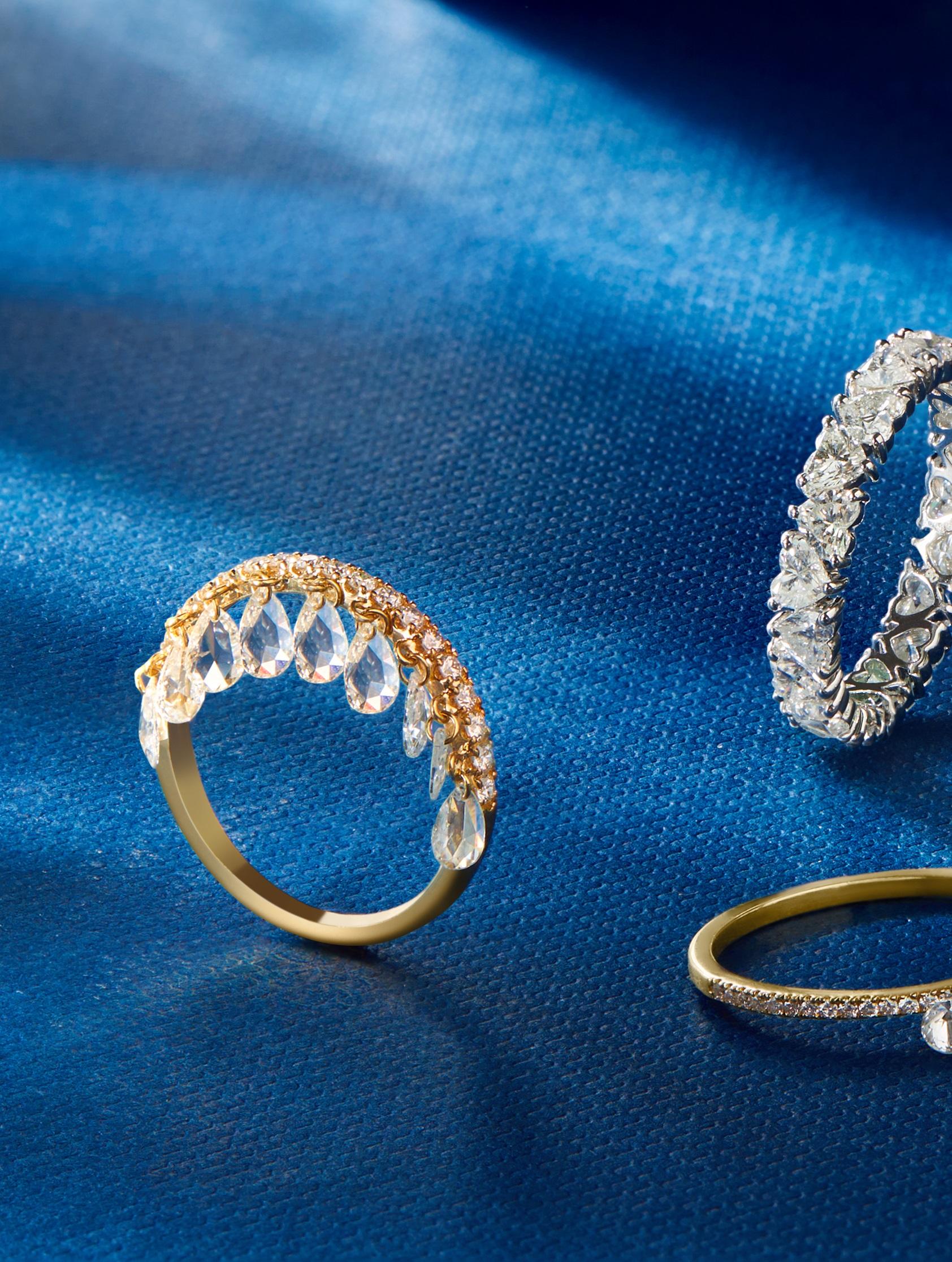 Delicate yet striking, this pear-shaped dangling rose-cut diamond ring by Vera Belleza is a masterpiece of modern elegance. Featuring exquisitely pierced diamonds that sway gracefully, the design captures light with every movement, adding a touch of