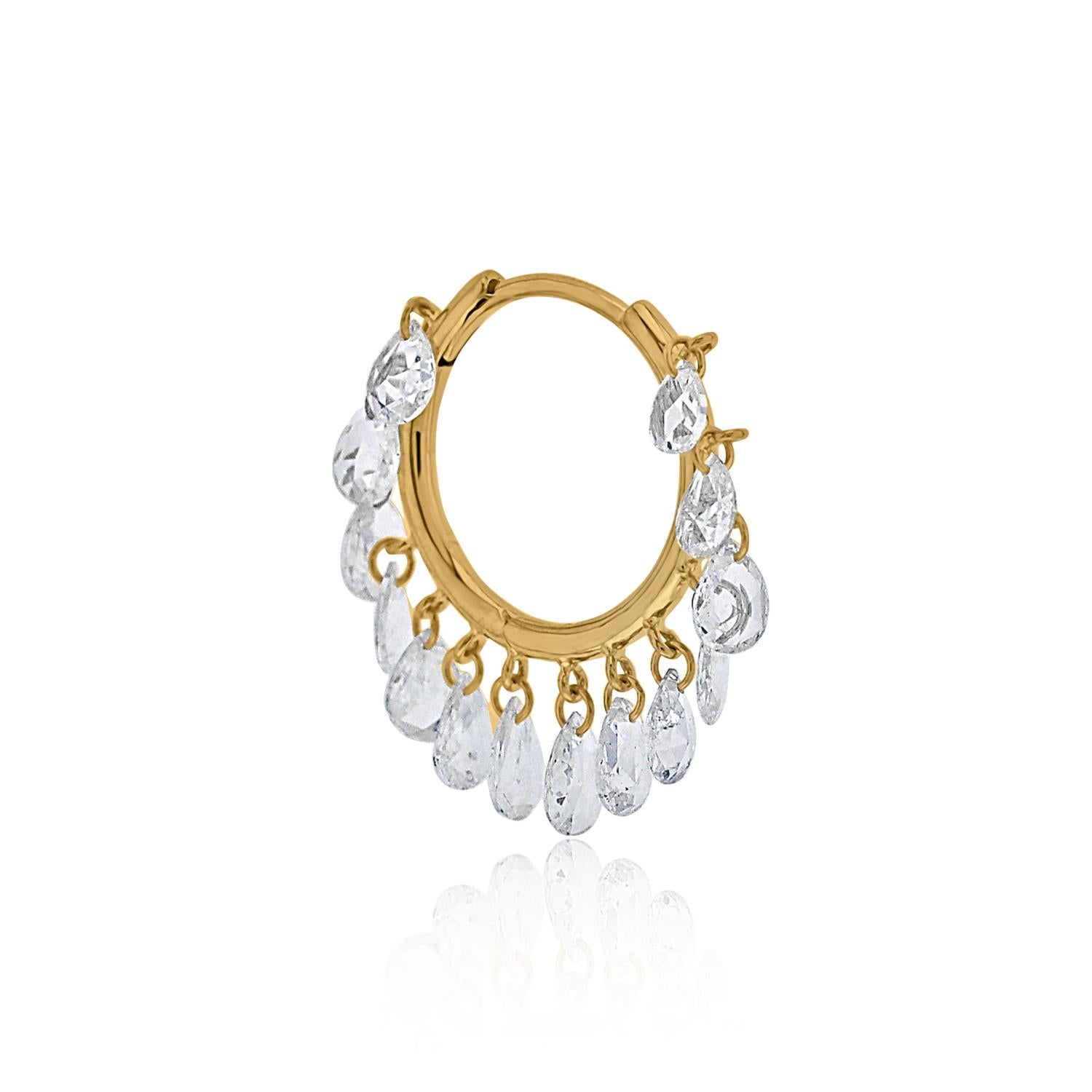 These stunning pear shaped rose cut diamond hoops are the epitome of understated luxury and timeless elegance. Each hoop features a collection of meticulously pierced rose cut diamonds, suspended delicately to create a subtle, yet captivating,