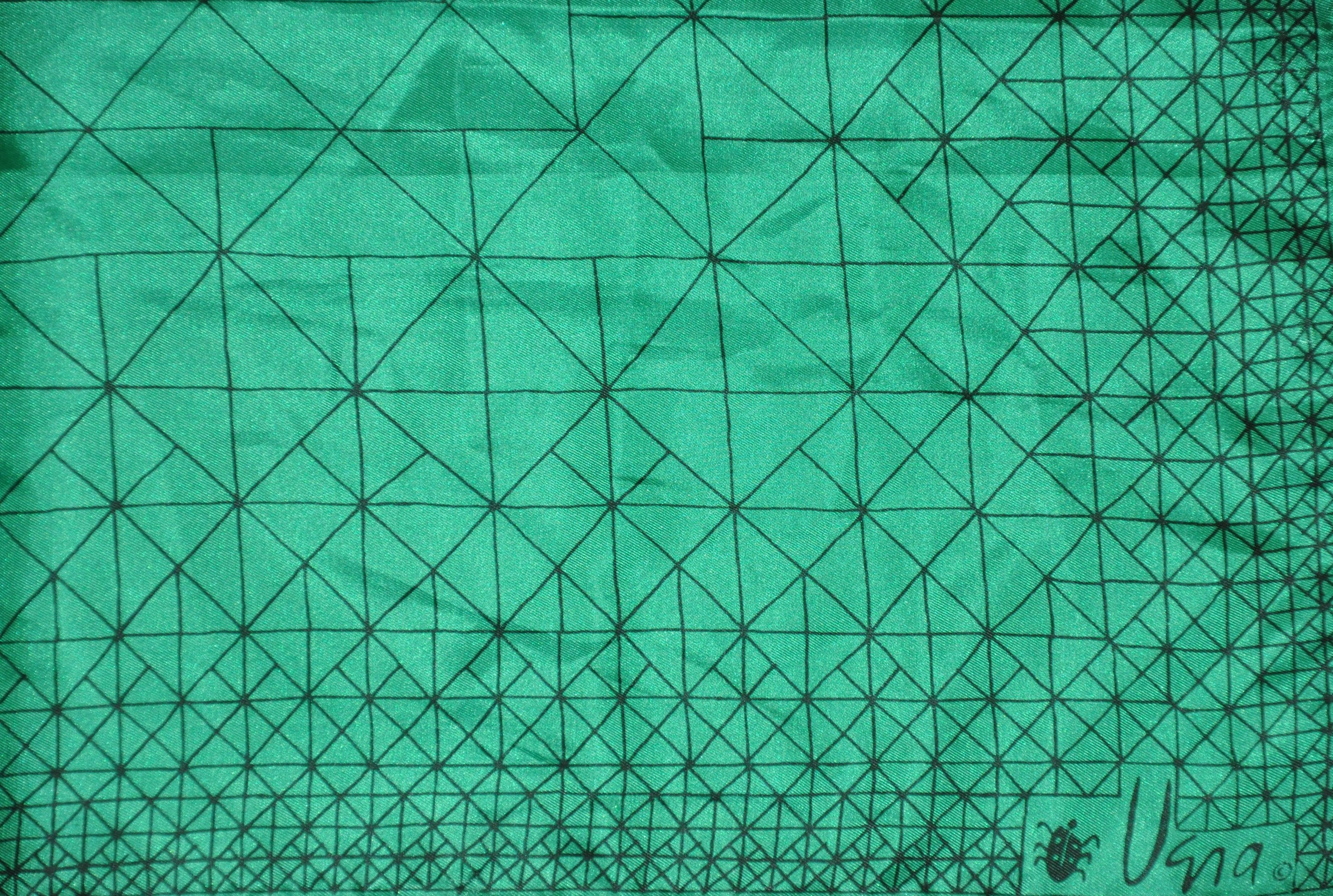        Vera emerald green with black etching throughout scarf measures 22 inches by 22 inches. Made in Japan of polyester.