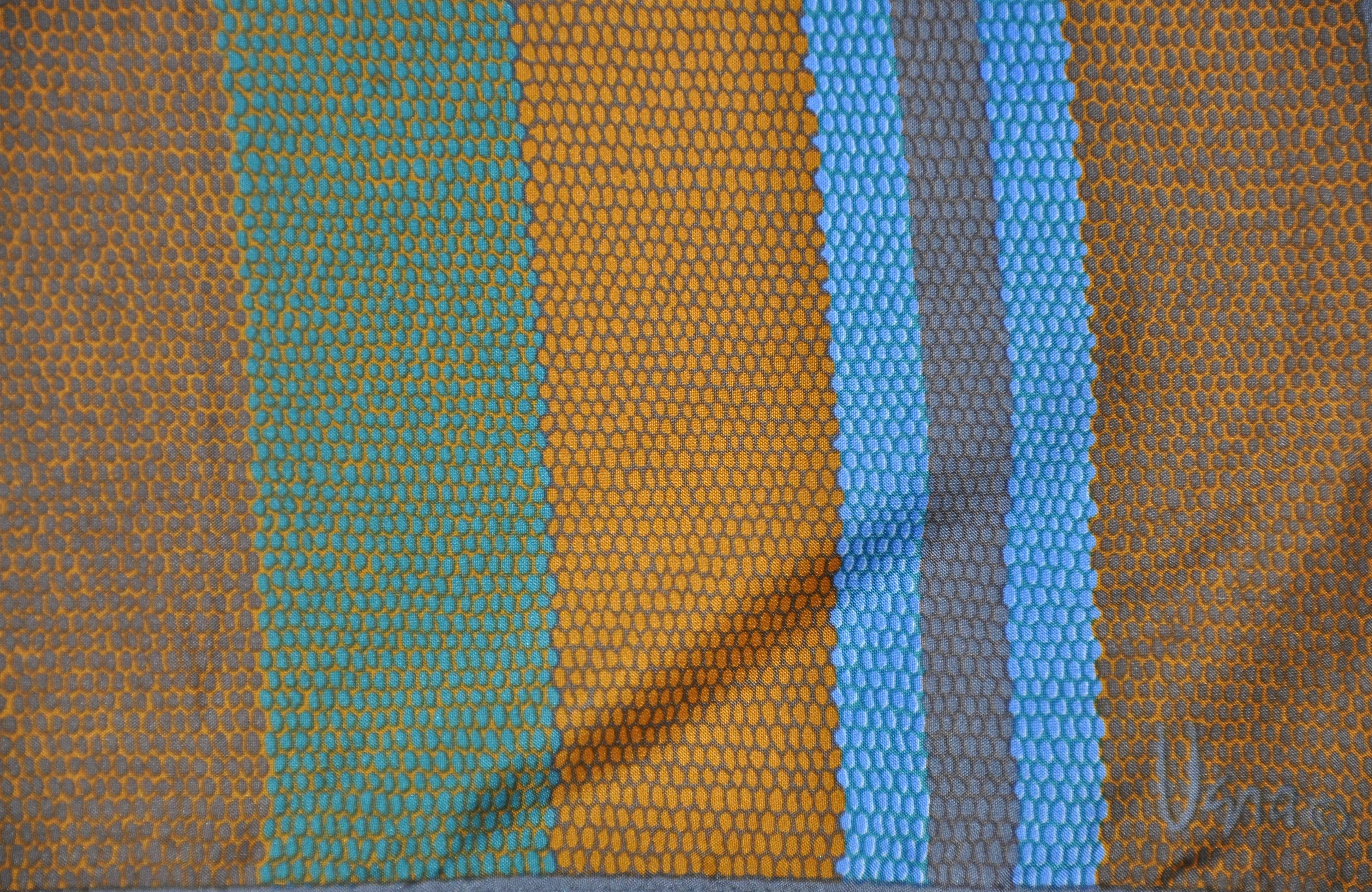        Vera's multi-colors of browns, olive, and deep turquoise wonderfully accents the 