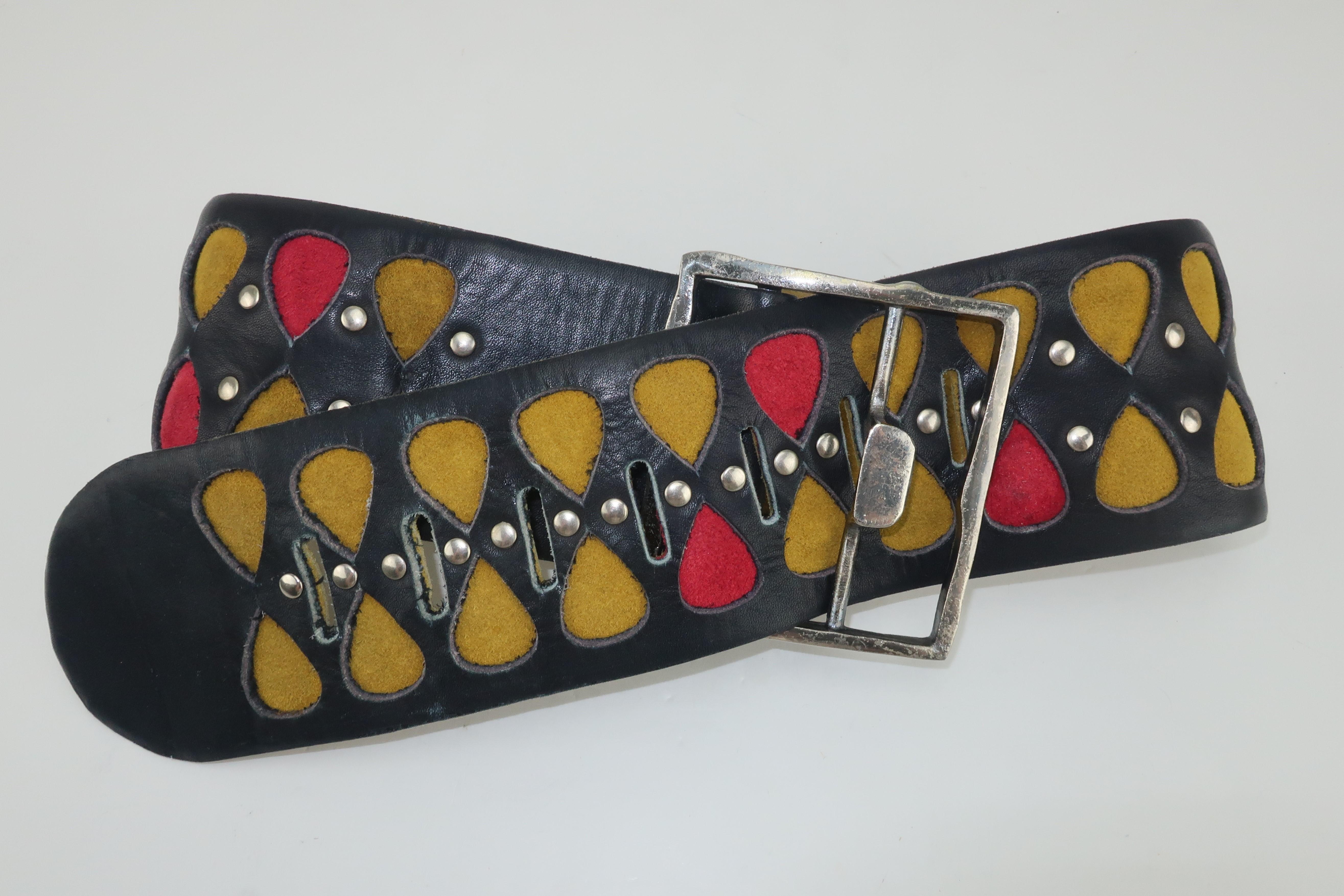 A mod 1960's black leather silver studded belt with red and golden yellow (almost chartreuse) suede teardrop inserts by artist and designer, Vera Neumann.  Ms. Neumann was best know for her colorful cheery silk scarves which she produced in the mid