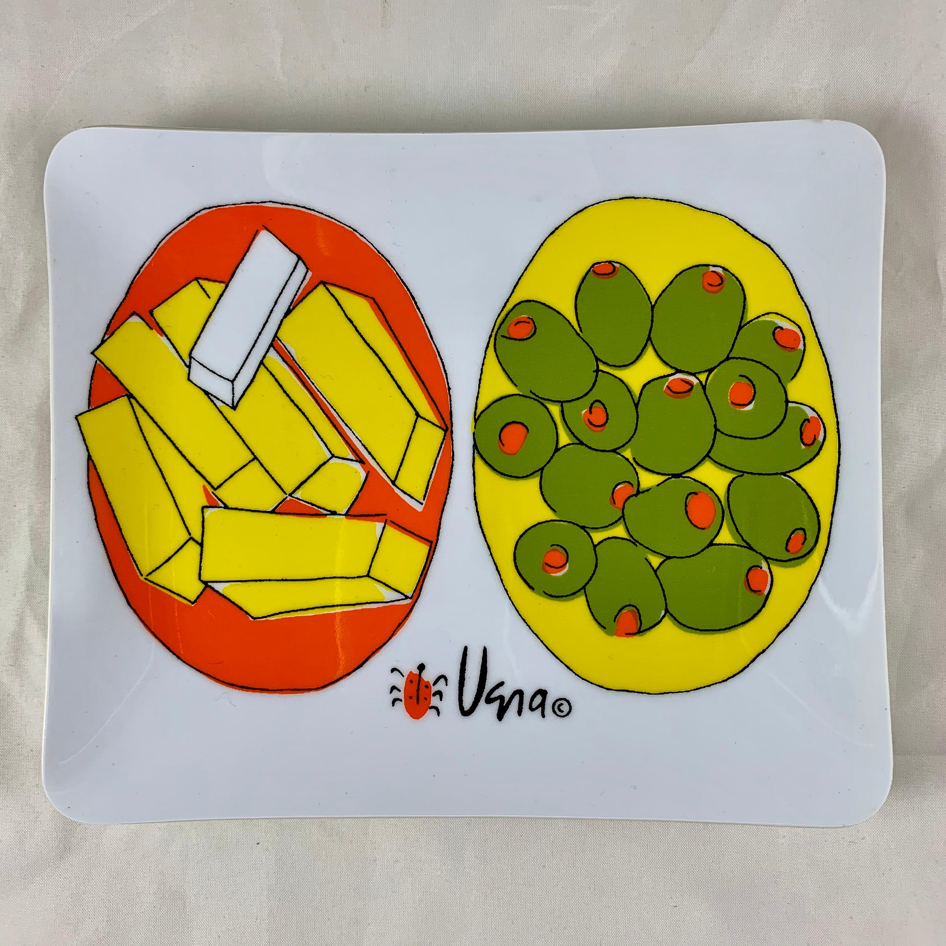 From the studio of the prolific and wildly popular midcentury designer and artist, Vera Neumann, a set of four plastic individual canapé or hors d’oeuvre trays with brightly printed images of cheese and olives.  From the retro line re-introduced in