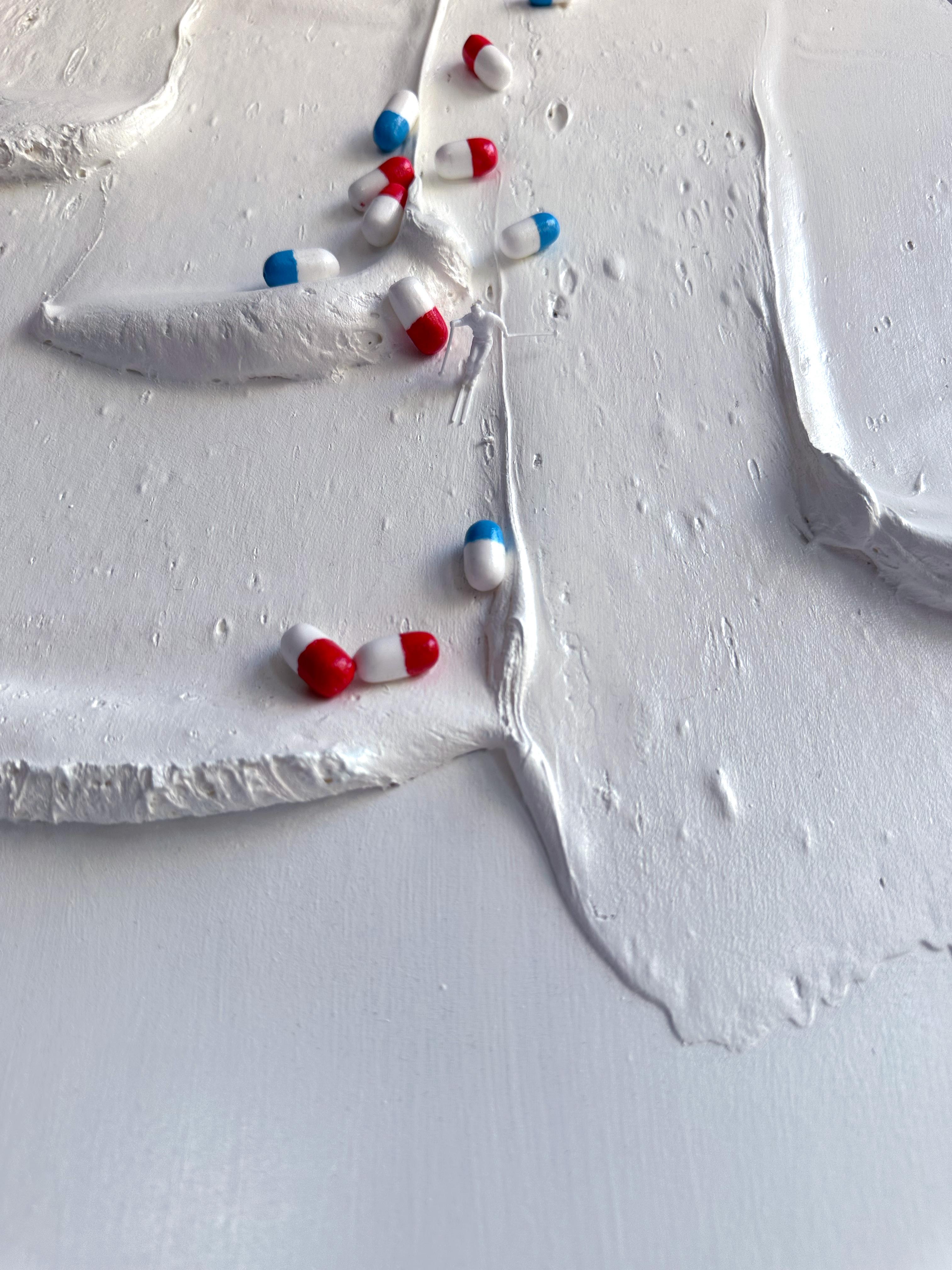 Avalanche moon relief in foam clay and acrylic, white palette with pill-like figurines, stages a snowlike flood that links natural avalanche imagery to mental and psychiatric metaphors.
Avalanche Moon Relief presents an embodied encounter between