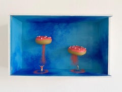 Miniatur-Wanddiorama mit schwebenden rosa Donuts – zeitgenössischer surrealistischer Schatteneffekt