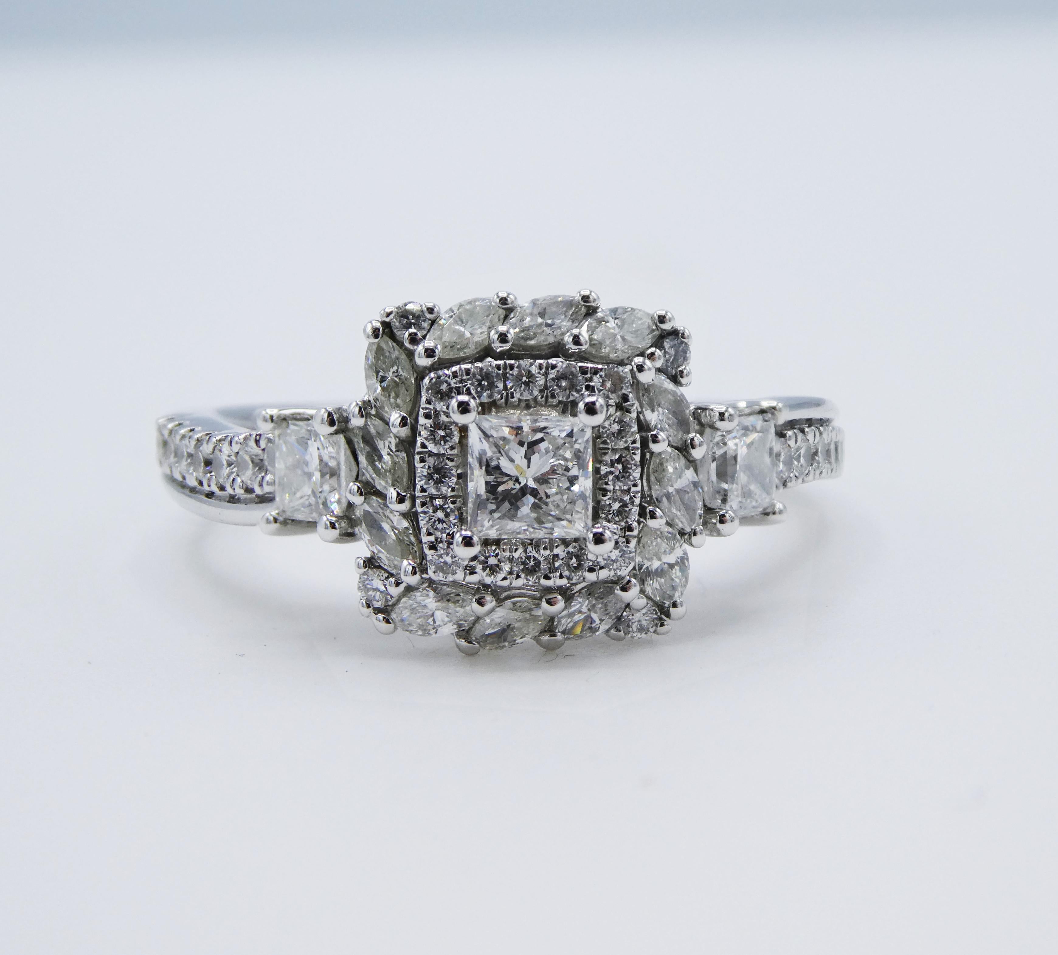 Vera Wang 1.00 CTW Diamond 14k White Gold Double Halo Engagement Ring Size 10

Metal: 14k White Gold, marked 14KT
Weight: 6.53 grams
Diamonds: 49 diamonds, approx. 1.00 CTW G-H SI
Top of ring measures approx. 11 x 11mm 
Size 10
Signed: Vera Wang