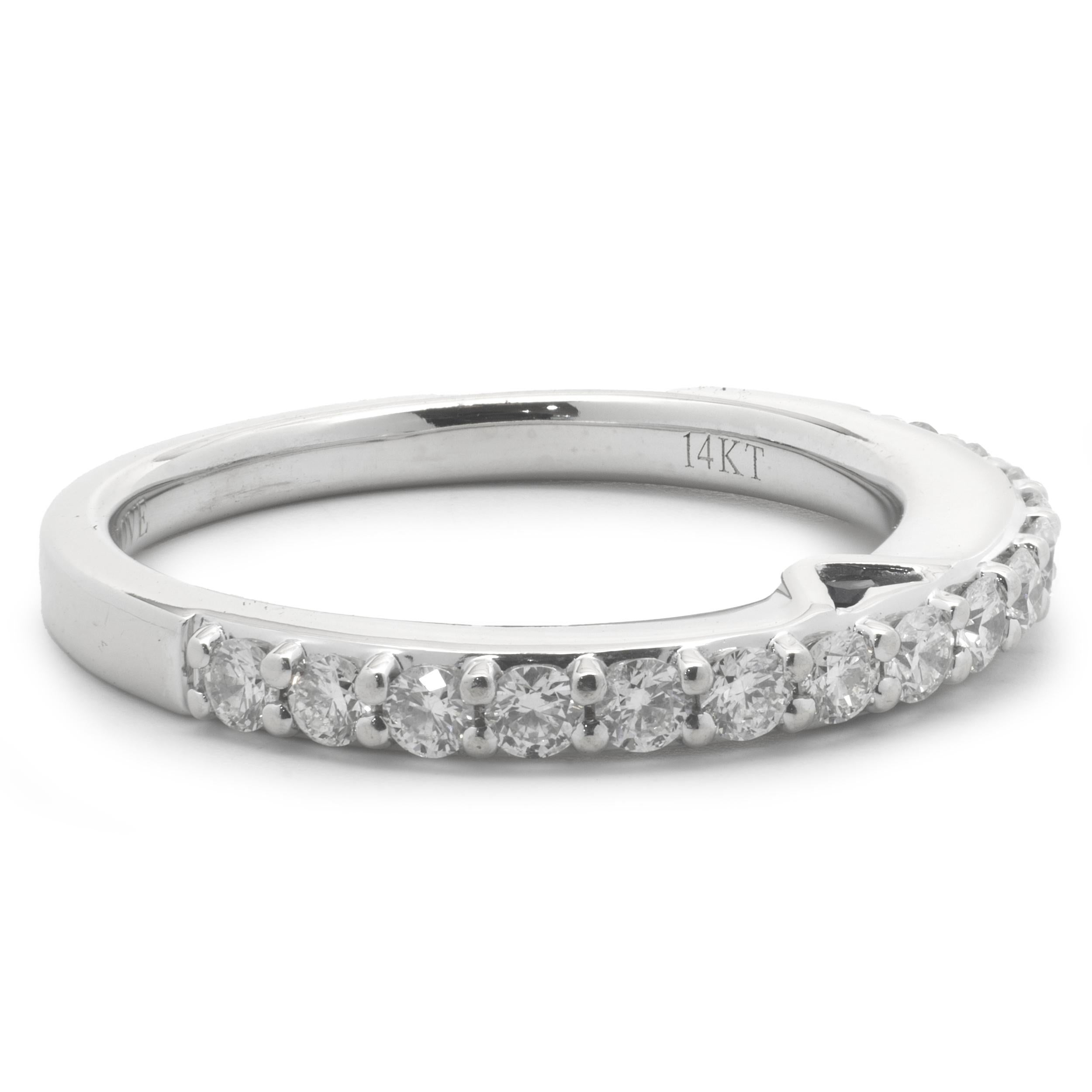 Designer: Vera Wang
Material: 14K white gold
Diamond: 15 round brilliant cut = .70cttw
Color: G
Clarity: VS1-2
Size: 7
Weight: 3.70 grams
