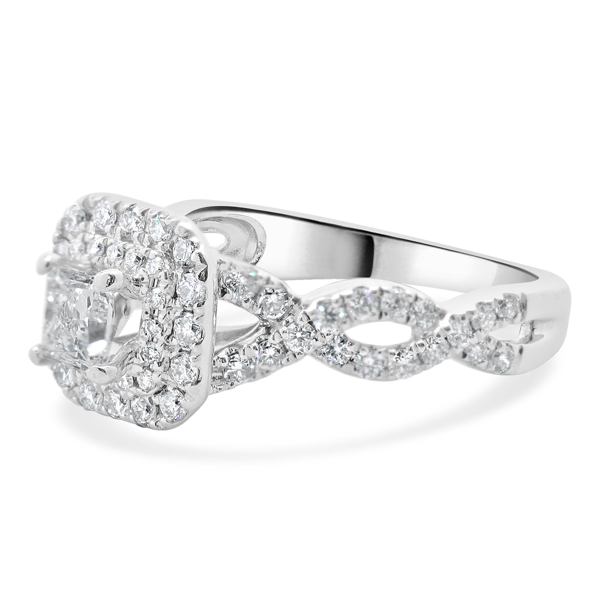 Designer: Vera Wang
Material: 14K white gold
Diamond: 1 princess cut = 0.36ct
Color: G
Clarity: SI1
Diamond: 69 round brilliant cut = 0.57cttw
Color: G
Clarity: SI1
Dimensions: ring top measures 9.37 mm wide
Ring Size: 6.25 (complimentary sizing