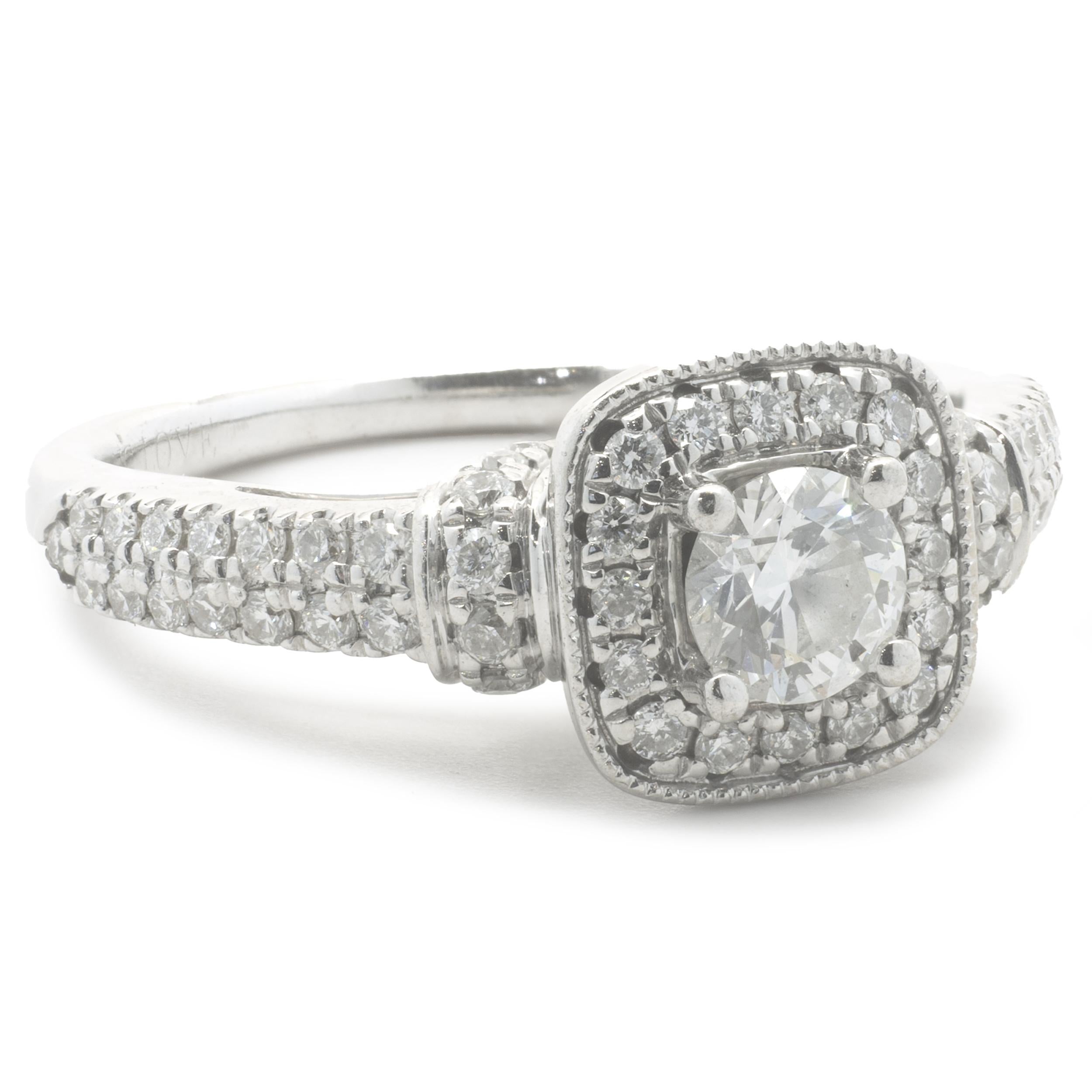 Designer: Vera Wang
Material: 14K white gold
Diamond: 1 round brilliant cut = .35ct
Color: H
Clarity: SI1
Diamond: 60 round cut = .60cttw
Color: G
Clarity: SI1
Ring Size: 6.5 (please allow up to 2 additional business days for sizing