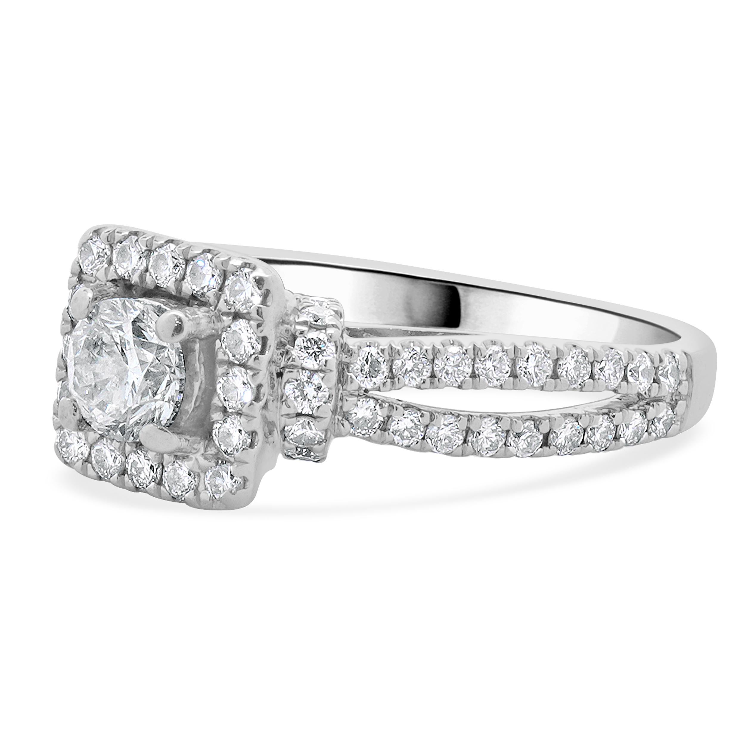 Designer: vera wang
Material: 14K white gold
Diamond: 1 round brilliant cut = 0.34ct
Color: I
Clarity: I1
Diamond: 71 round brilliant cut = 0.70cttw
Color: H
Clarity: I1
Dimensions: ring top measures 8mm wide
Ring Size: 5 (complimentary sizing