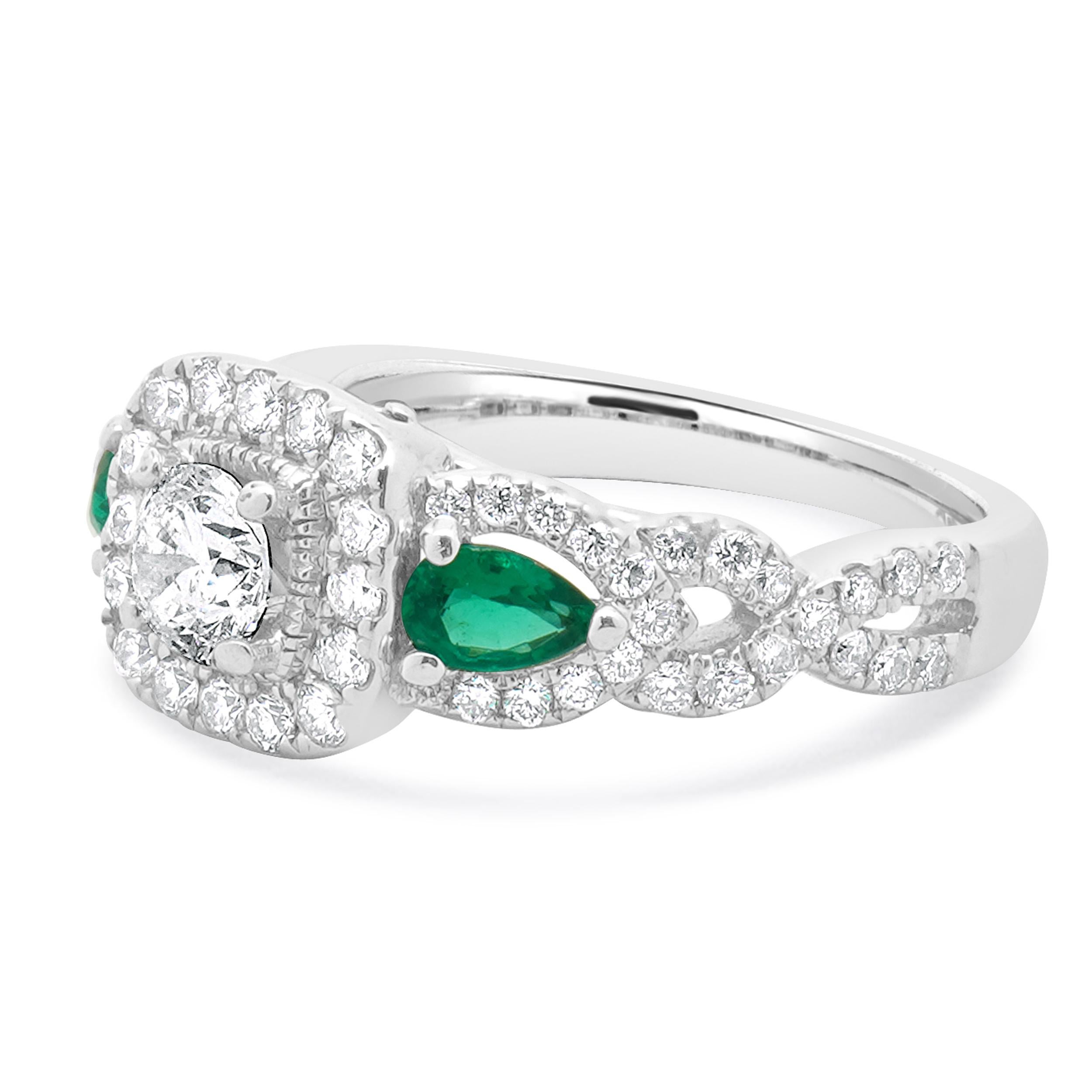 Designer: Vera Wang
Material: 14K white gold
Center Diamond: 1 round cut= 0.40cttw
Color: H
Clarity: SI2
Diamonds: 65 rose cut= 0.53cttw
Color: H
Clarity: SI2
Sapphires: 0.06cttw
Emeralds: 0.20cttw
Size: 6
Weight: 5.60 grams
