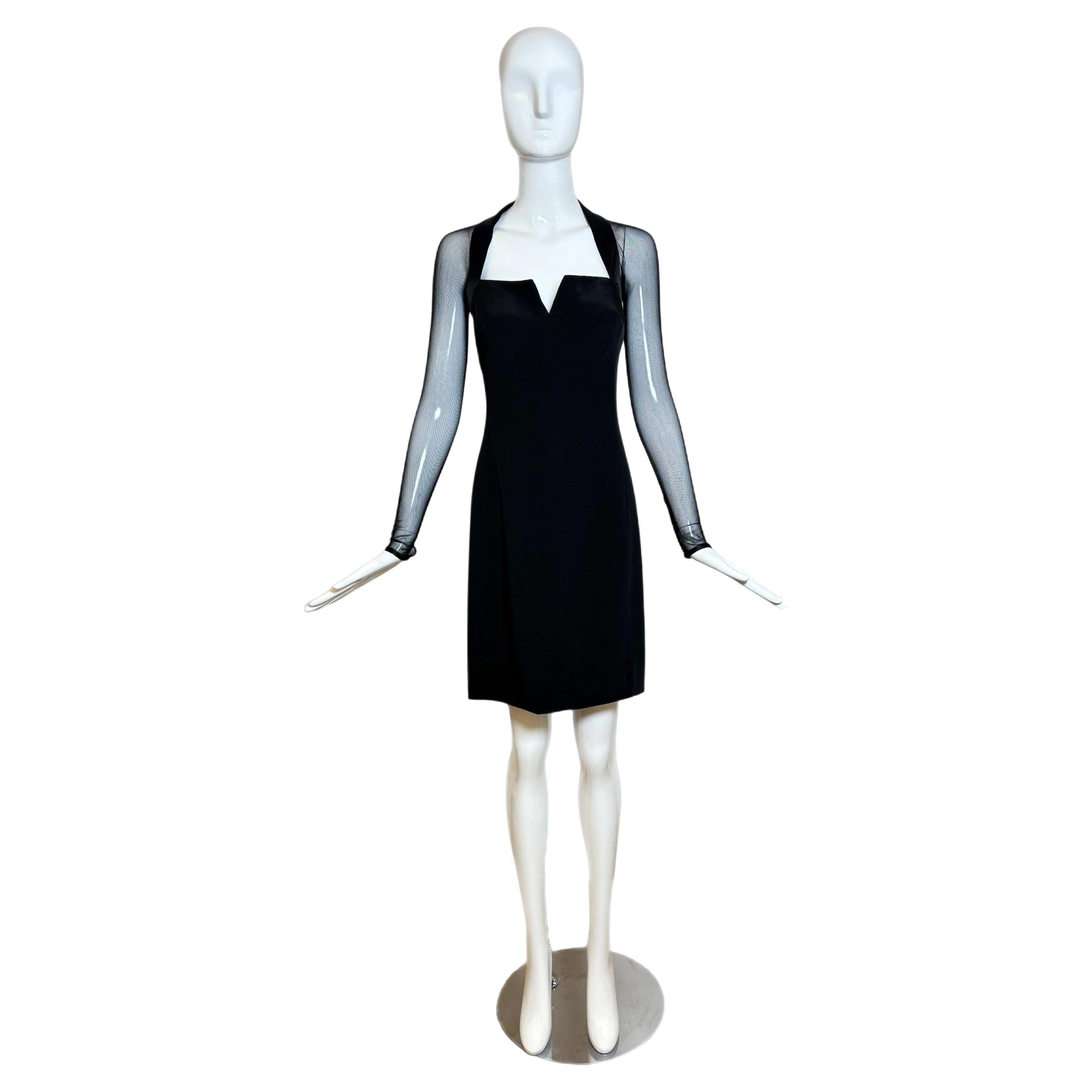 Vera Wang
1995
Vintage
Jet Black
100% softest silk
Sheer sleeves with sexy back seam and keyhole at wrists
Unique very sexy neckline, both the v part and how it lays around the décolleté to the shoulders to the back of the neck
Long back zip with