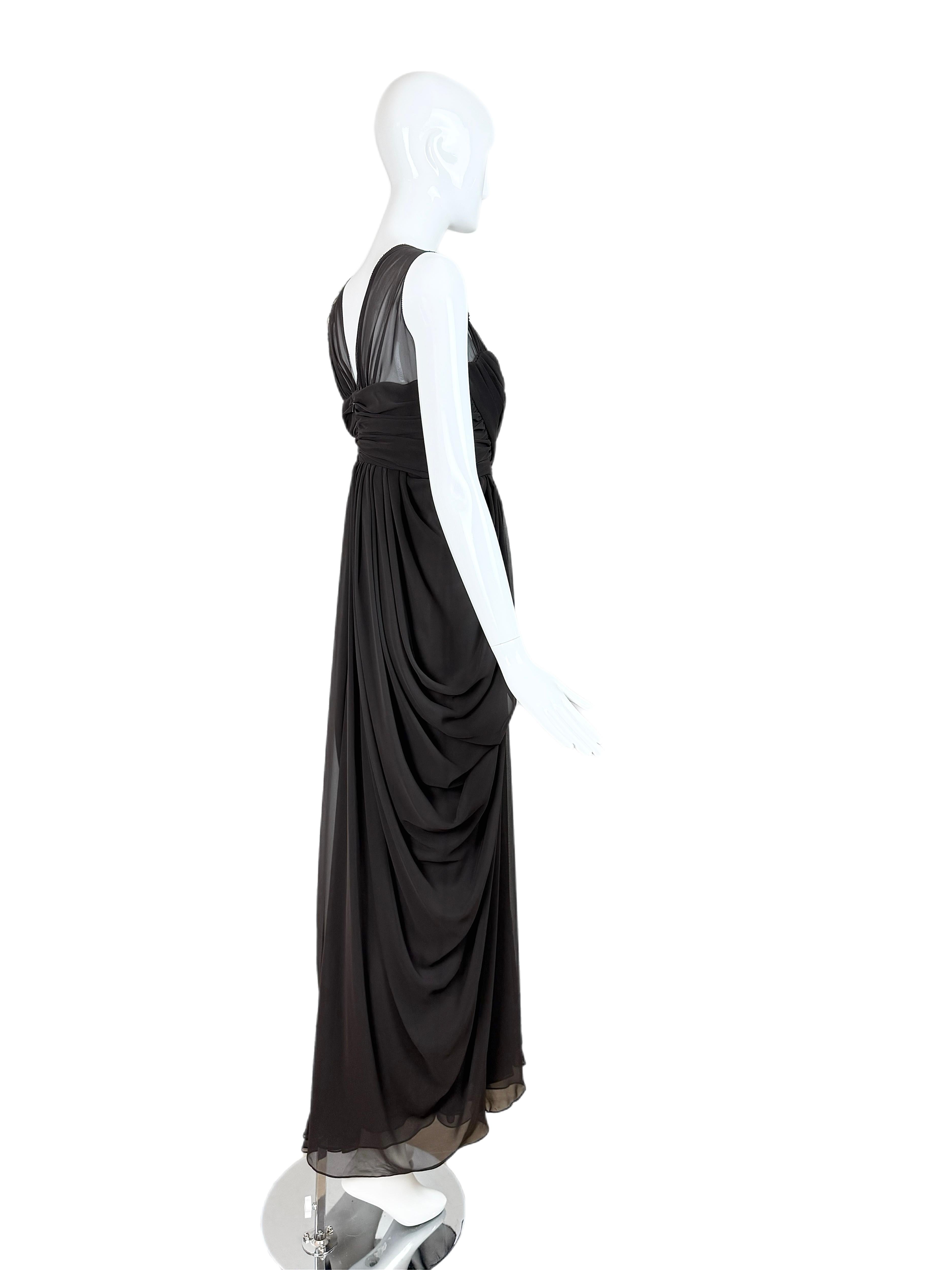 Vera Wang
Vintage
FW06
Runway
Unique dark grey color
Ivory, gold, and bronze colored beading at the shoulder
Tag says shell is poly, but looks and feels like silk
Size Euro 42
1 glitch/snag in the bottom fabric as pictured (otherwise Pristine)
You