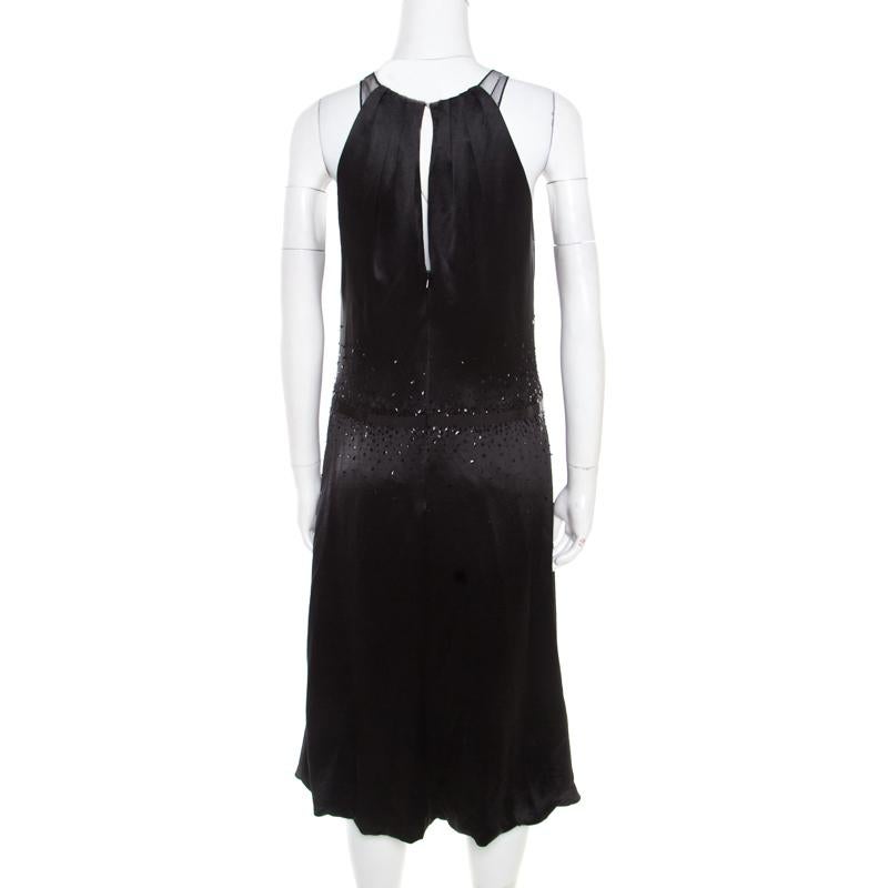 Look nothing less than a fashion model in this Vera Wang dress. This stylish black piece is ideal for all occasions and all seasons. Tailored from quality materials, this dress, with sequin embellishments and bow detail, is sure to grab everyone's