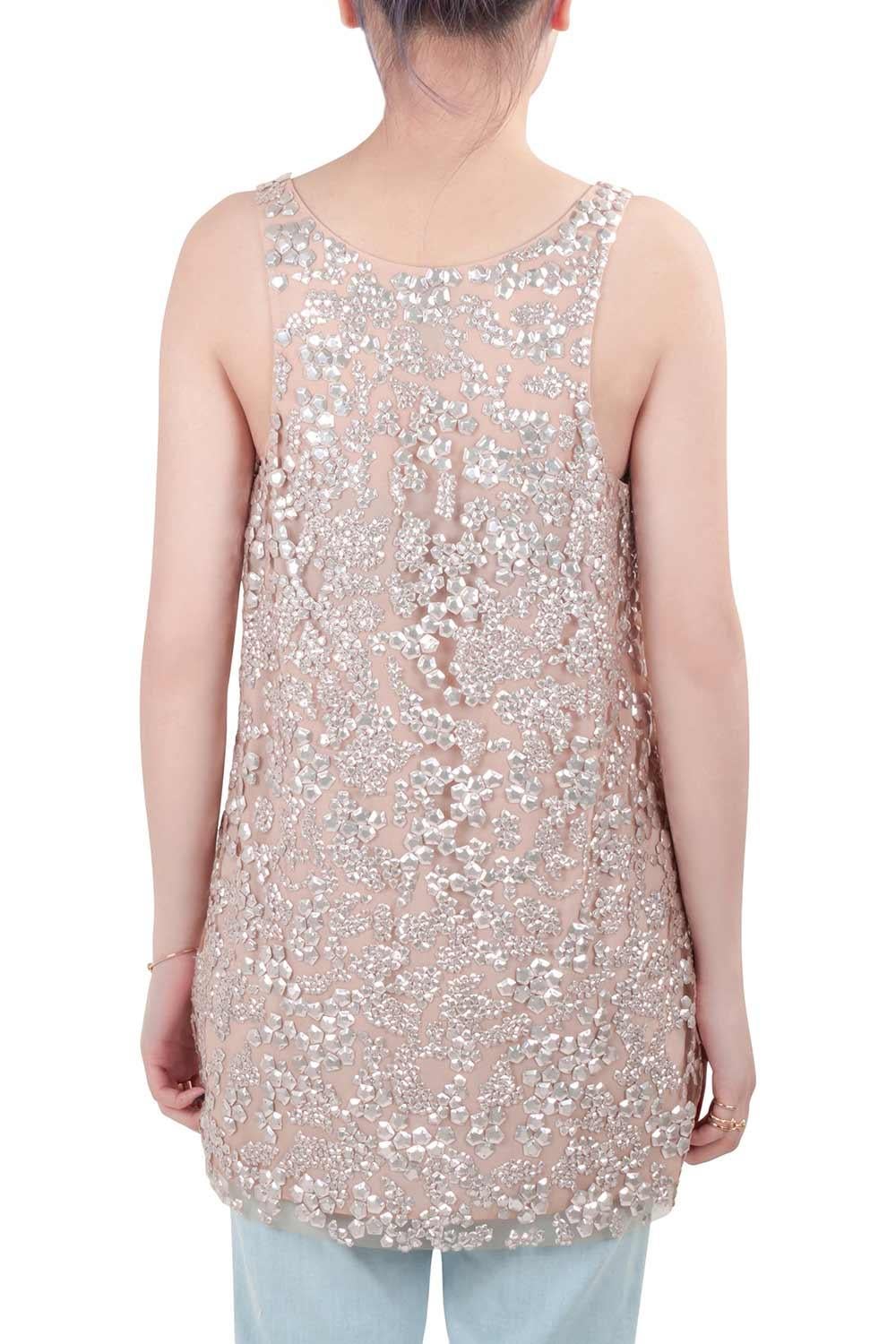 Masterfully tailored from nylon, this sequin embellished top features tulle overlay in blush pink color. Designed by Vera Wang the sleeveless top will dazzle your evening with its appeal. Team it with simple bottoms to let the top