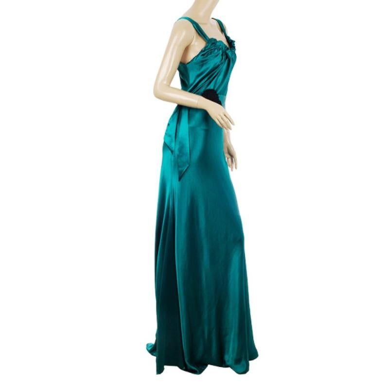 This breath taking teal evening gown by Vera Wang is made from an acetate blend with an asymmetrical flowing hem. It comes with a waist belt accented with floral detailing and is gathered at the top.

Includes: The Luxury Closet Packaging

