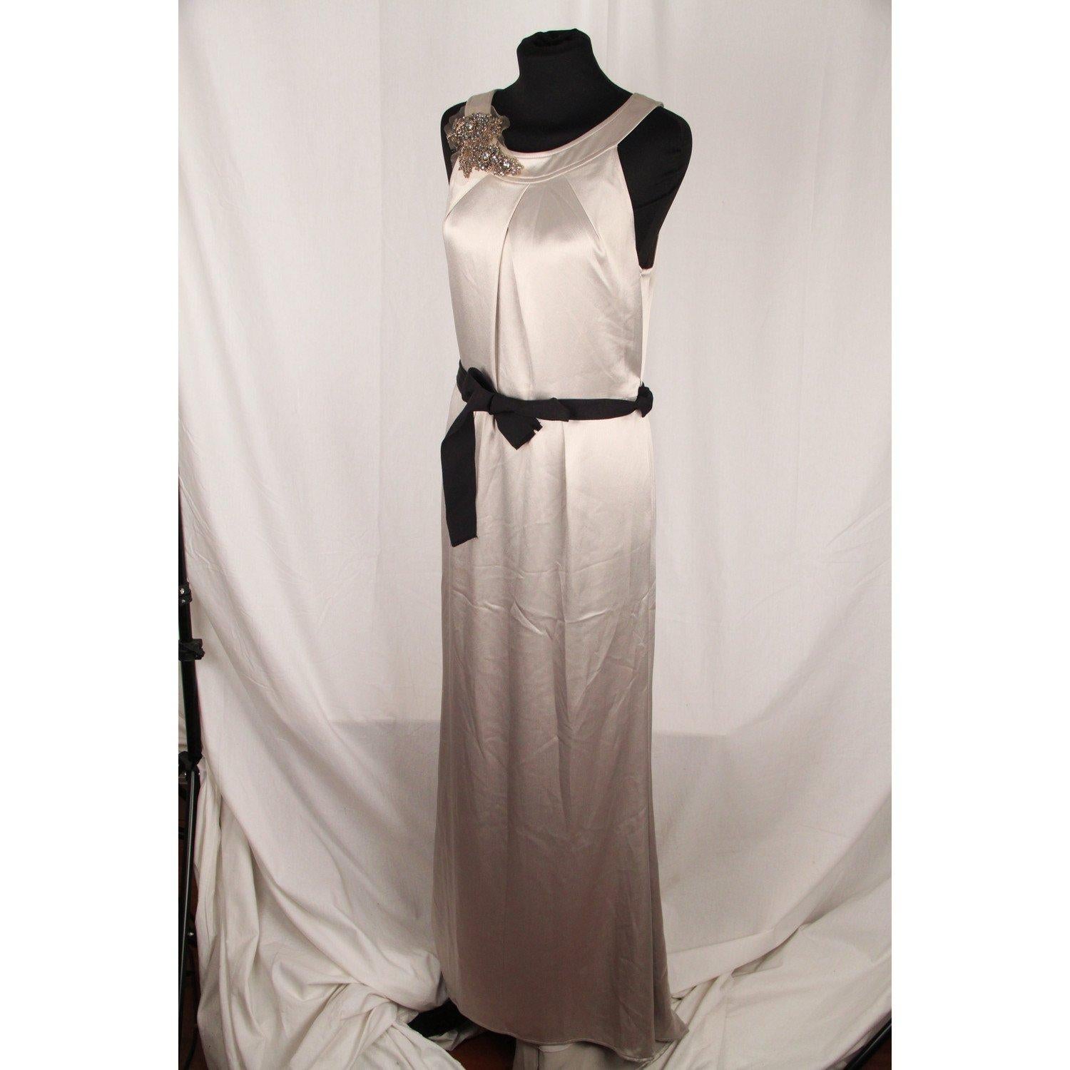 MATERIAL: Satin COLOR: Gray MODEL: Evening Dress GENDER: Women SIZE: Small COUNTRY OF MANUFACTURE: China Condition CONDITION DETAILS: A: EXCELLENT CONDITION: Gently used! a small spot on the back near the zip (neck) Measurements MEASUREMENTS: